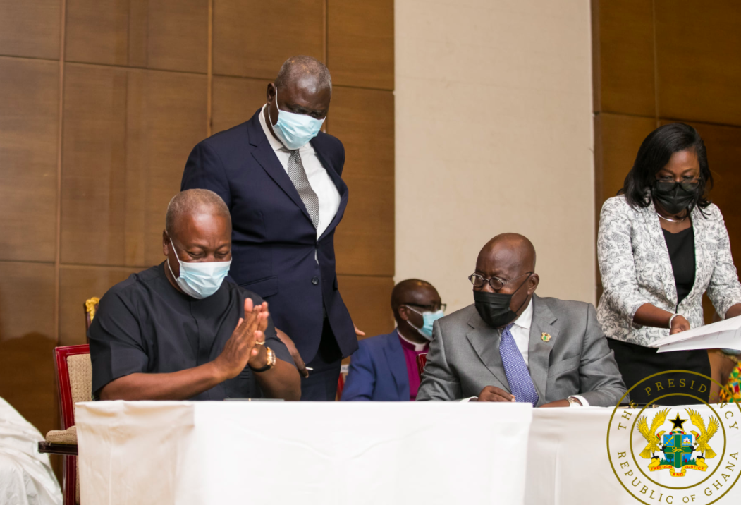 John Mahama and Akufo-Addo in a chit chat during signing of peace pact.