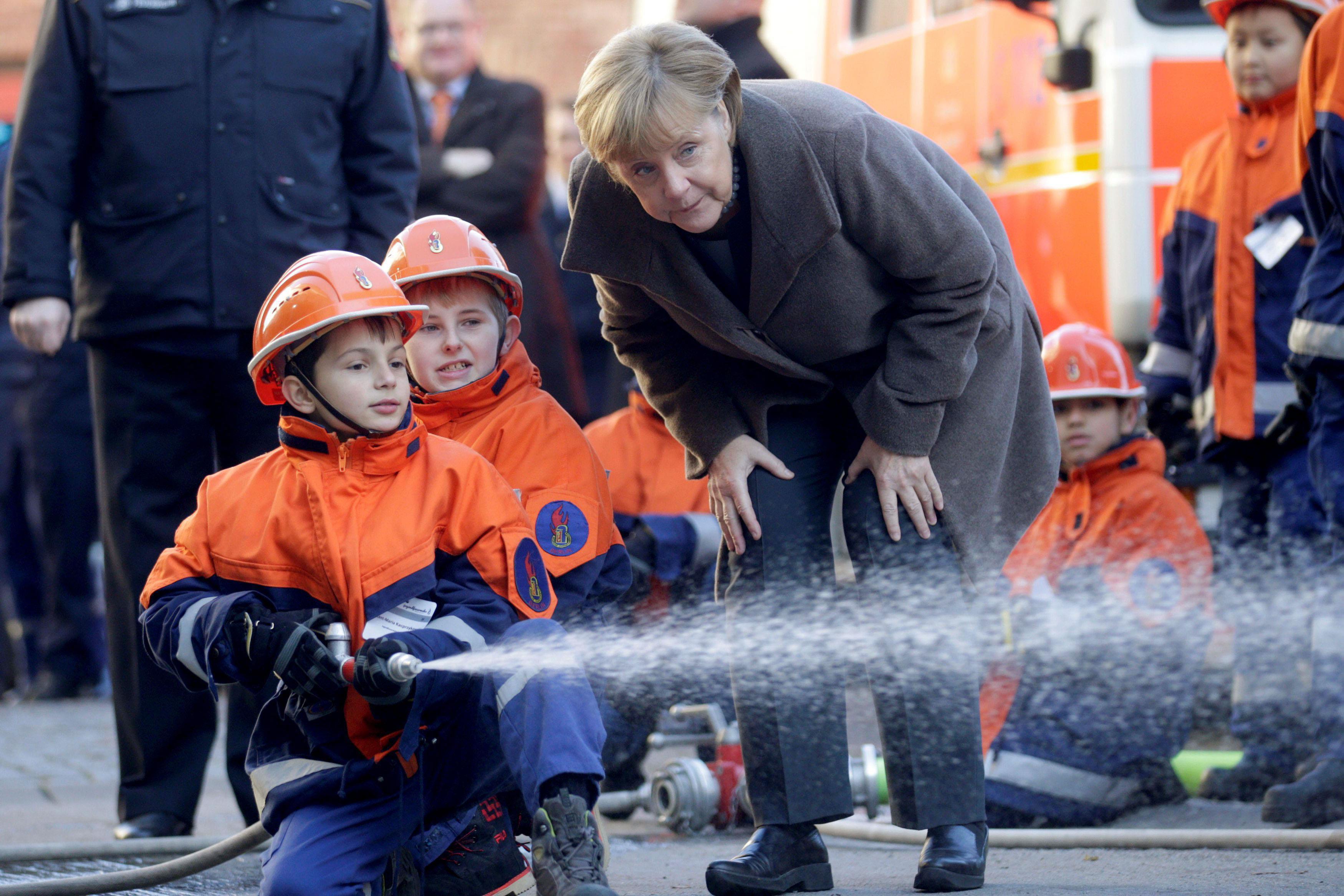 German Chancellor Merkel visits a youth fire brigade at Wedding in Berlin