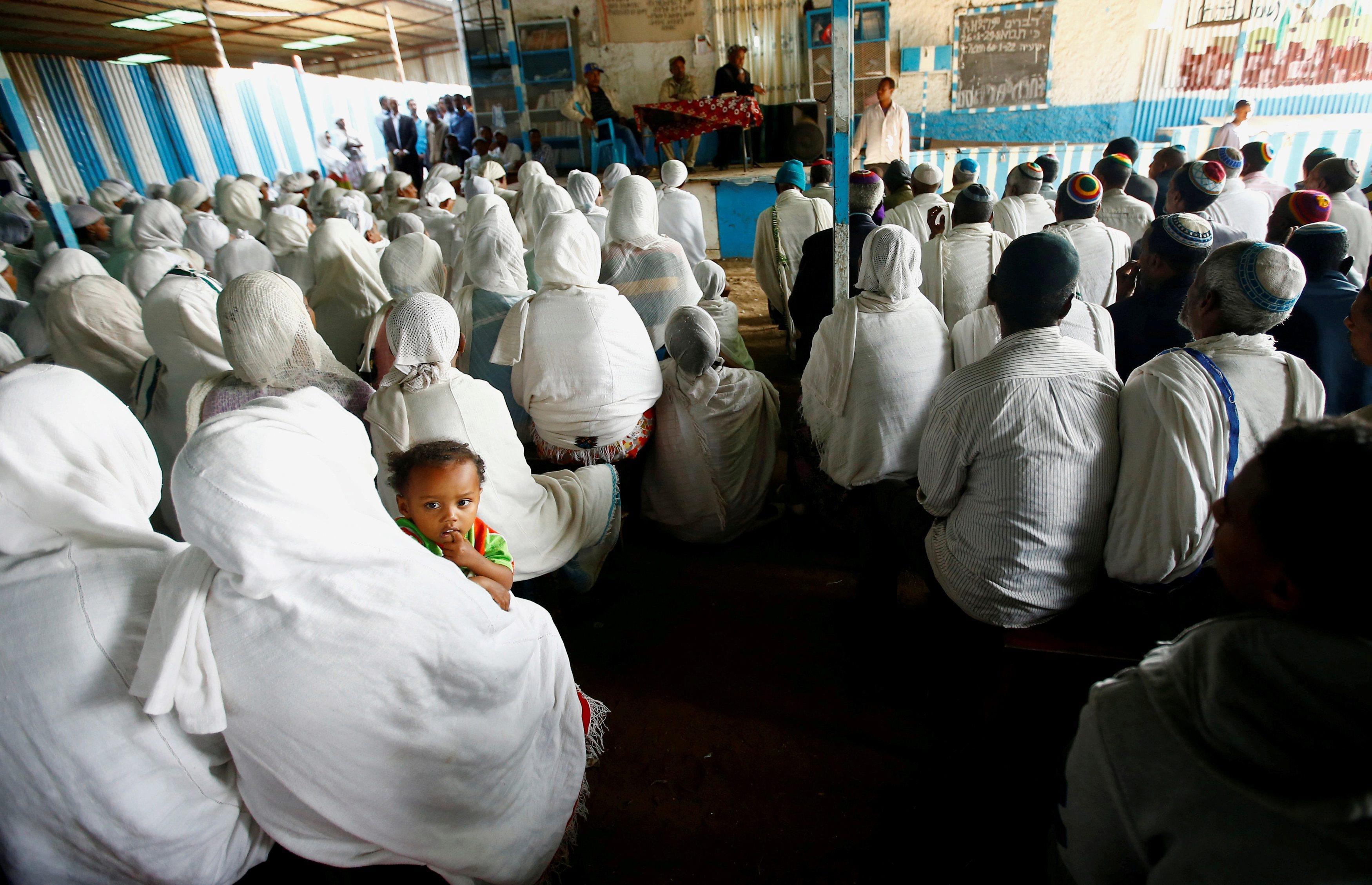 Members of the Falash Mura Jewish Ethiopian community attend a prayer service at the HaTikvah Synago