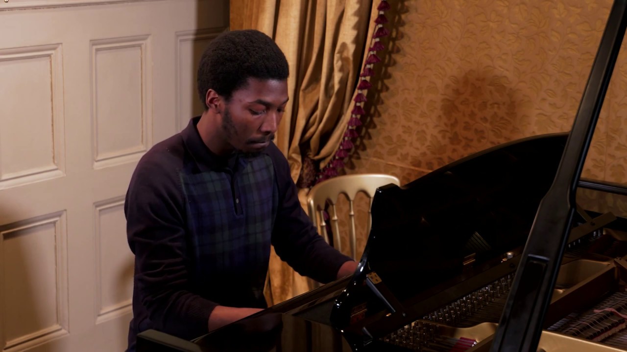 Made Kuti playing the piano [Dailyadvent]