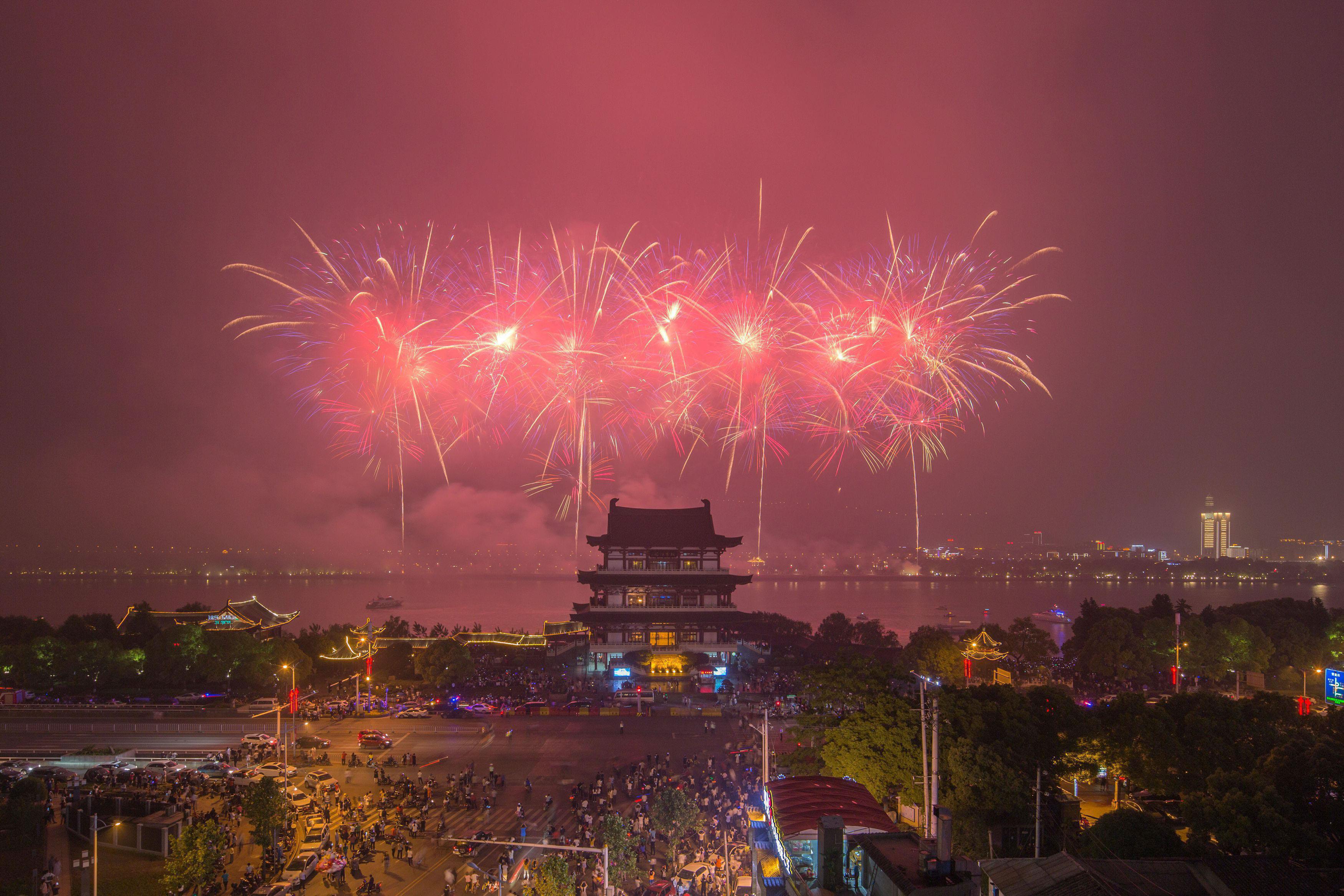 Fireworks explode during celebration events on International Labour Day in Changsha