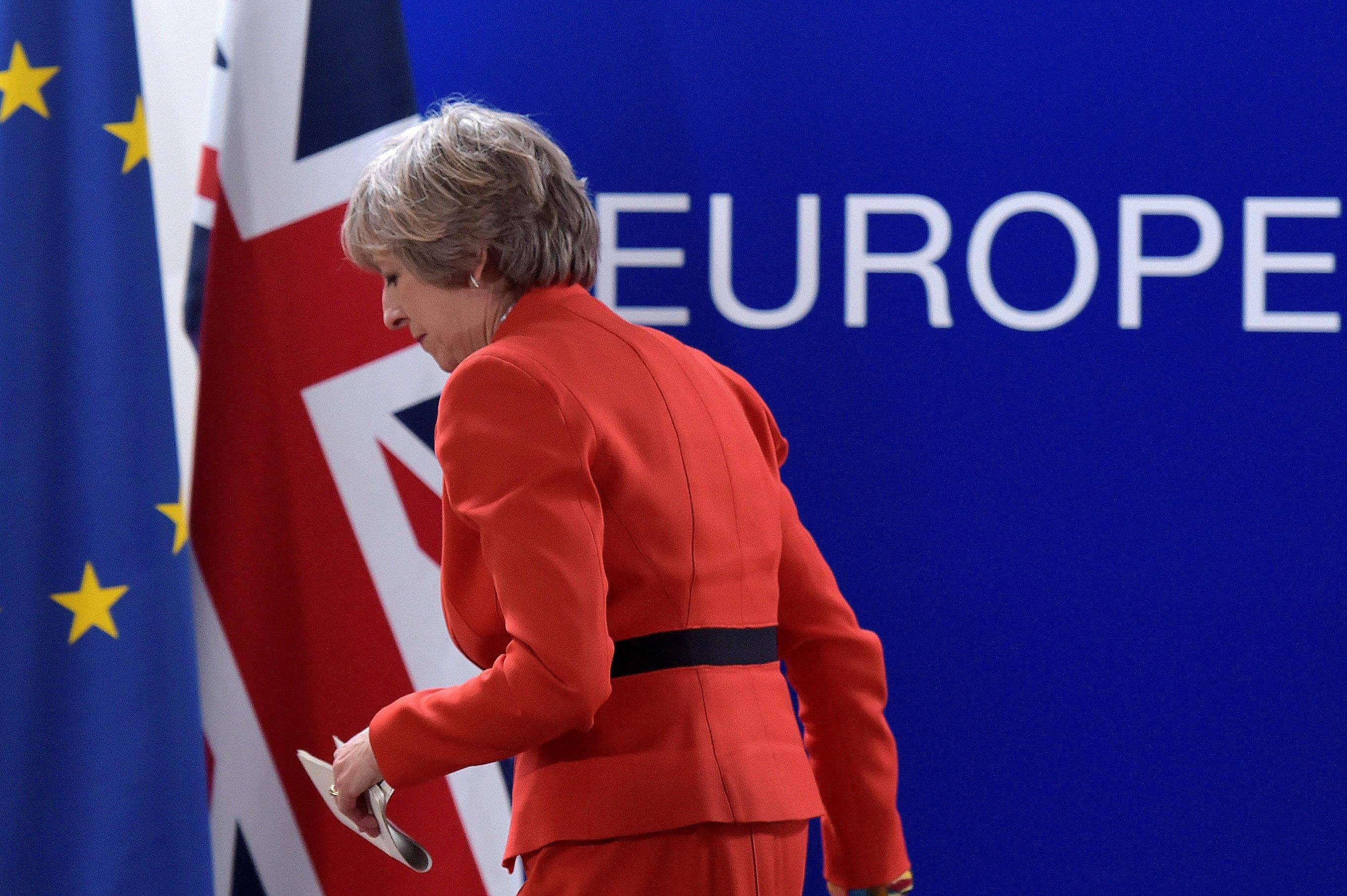 Britain's PM May leaves after a news conference at the end of the EU summit in Brussels