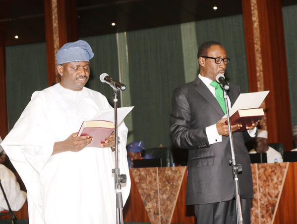 Femi Adesina (left) being sworn in as the President’s Special Adviser on Media and Publicity in 2019 (Presidency)