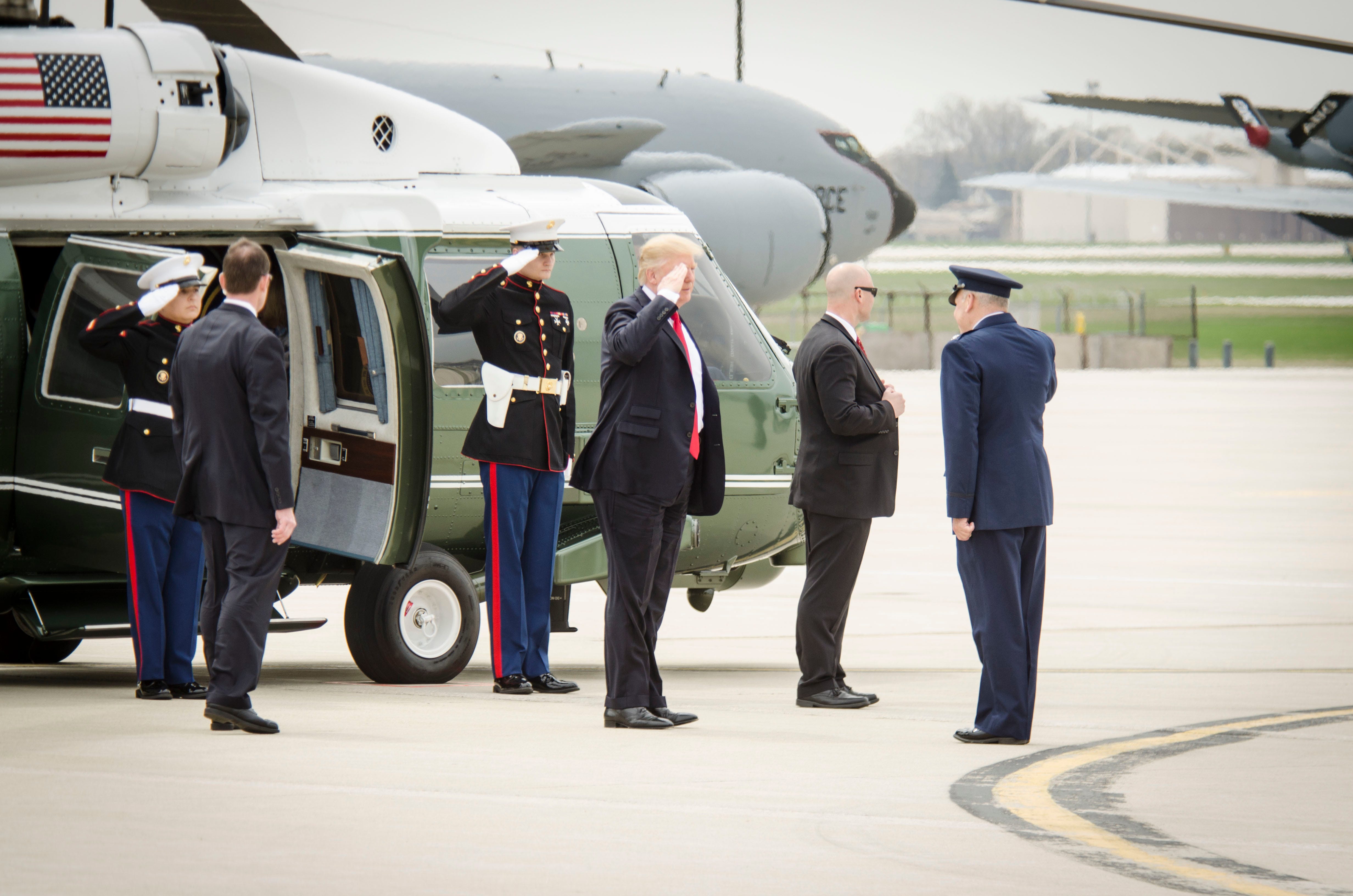 President Donald Trump salutes while stepping off Marine One amid restructuring discussions his administration is planning for U.S. Africa Command (AFRICOM) as part of Pentagon reforms