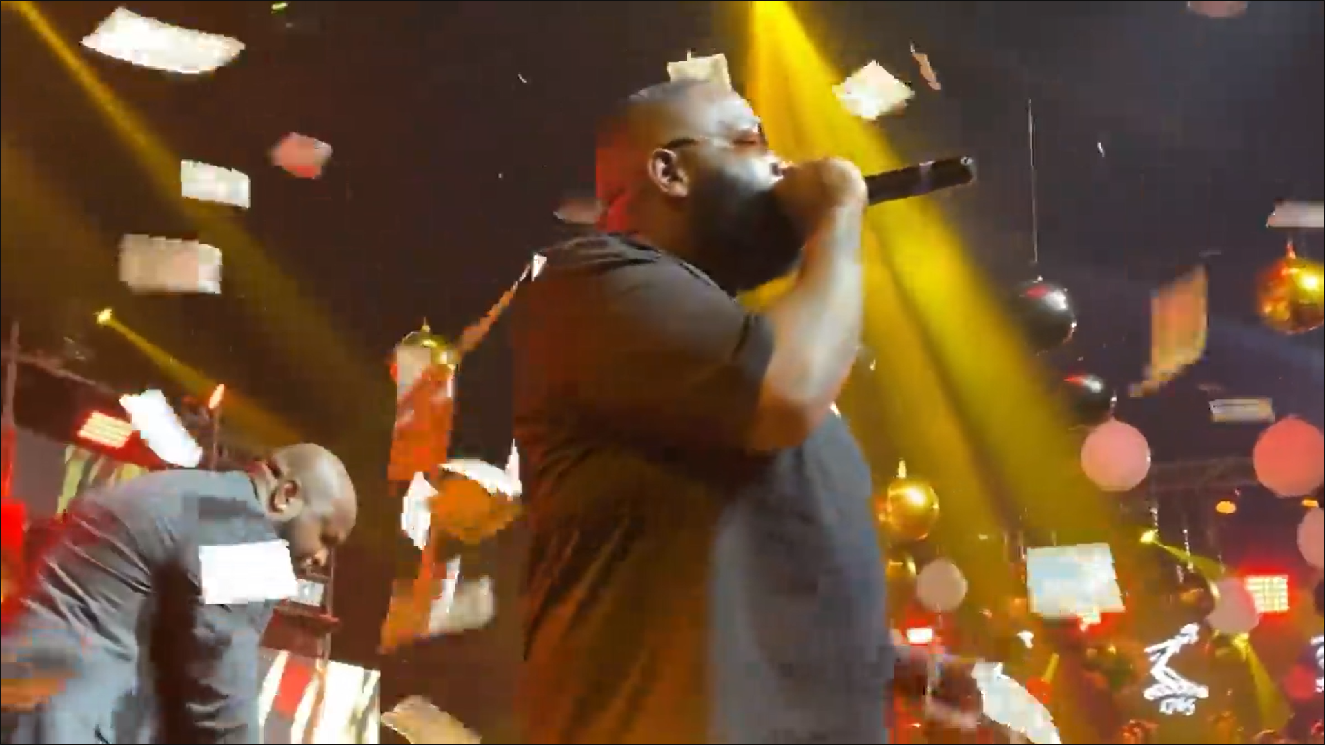 Nigerian socialite makes money rain at ‘Rick Ross’ Live in Lagos’ concert (WATCH)
