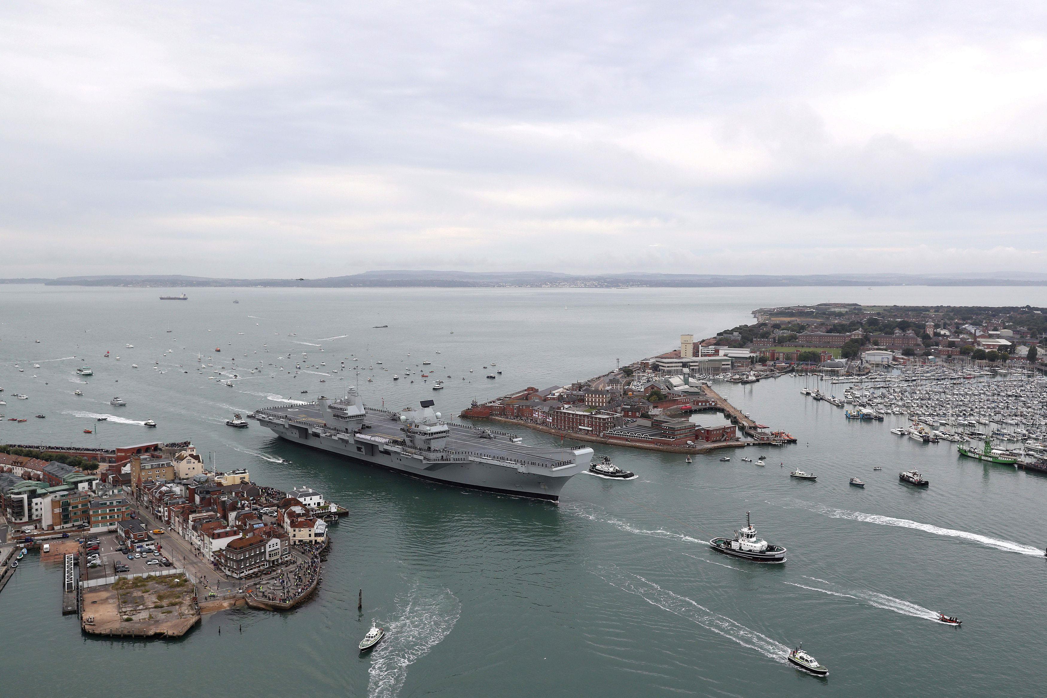The Royal Navy's new aircraft carrier, HMS Queen Elizabeth, arrives in Portsmouth