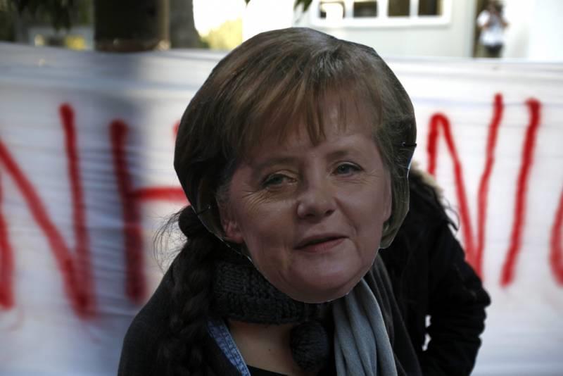 protesty Cypr Merkel, fot. AP PhotoPetros Karadjias