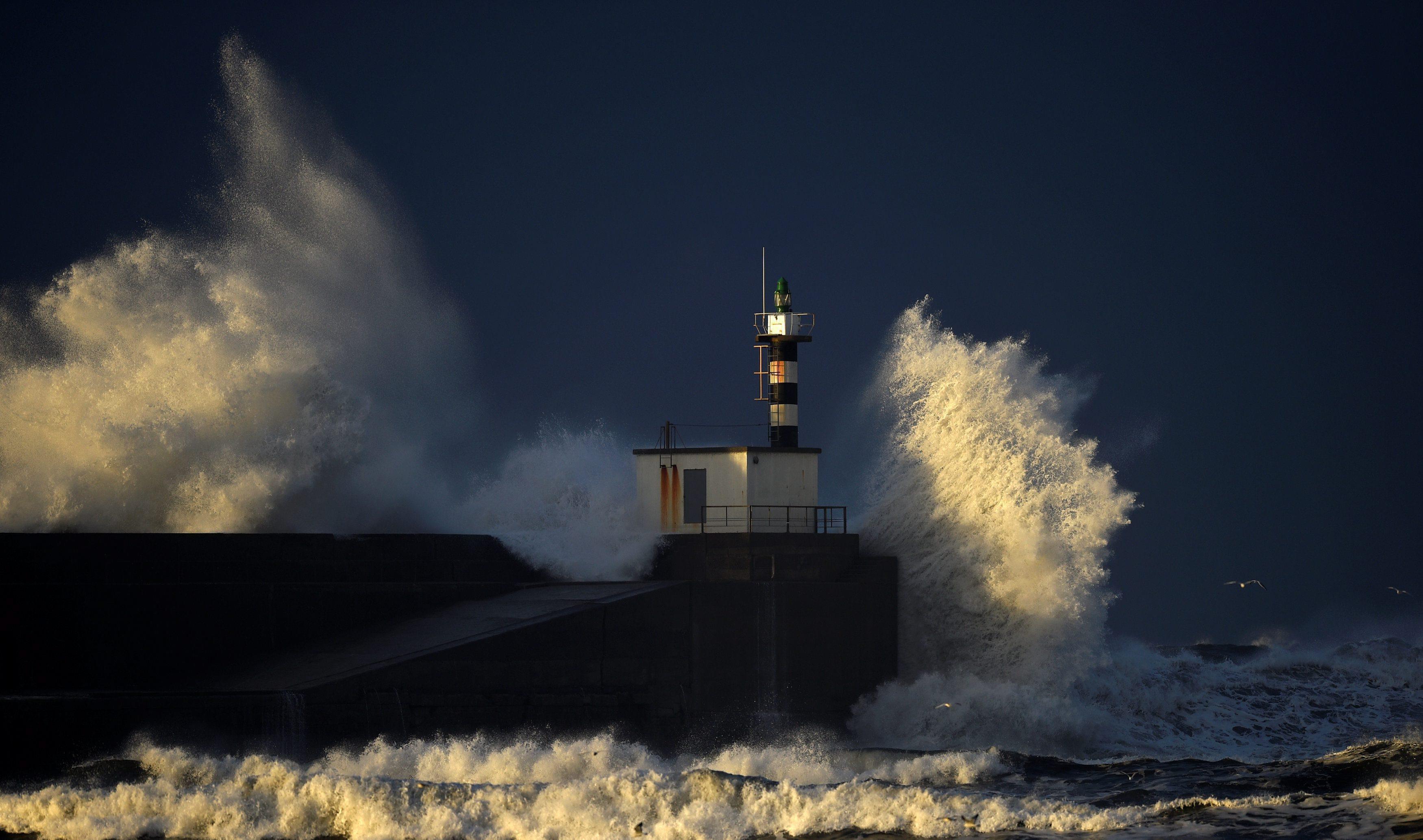 Huge waves crash on the San Esteban de Pravia seafront in the northern Spanish region of Asturias