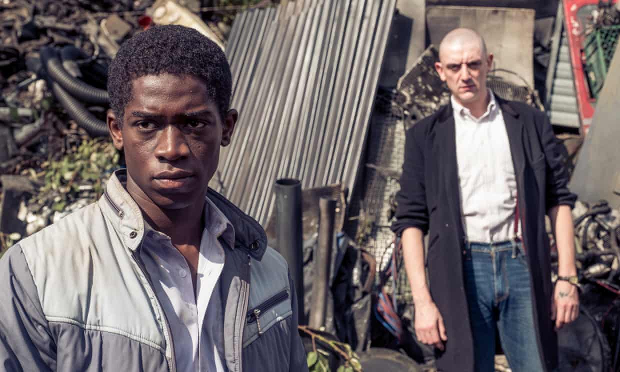 Enitan (played by Damson Idris (left) as a teenager) has to deal with being dehumanised by Levi (John Dagliesh) (right), the leader of a racist gang of skinheads known as the Tilbury Skins [Angus Young]