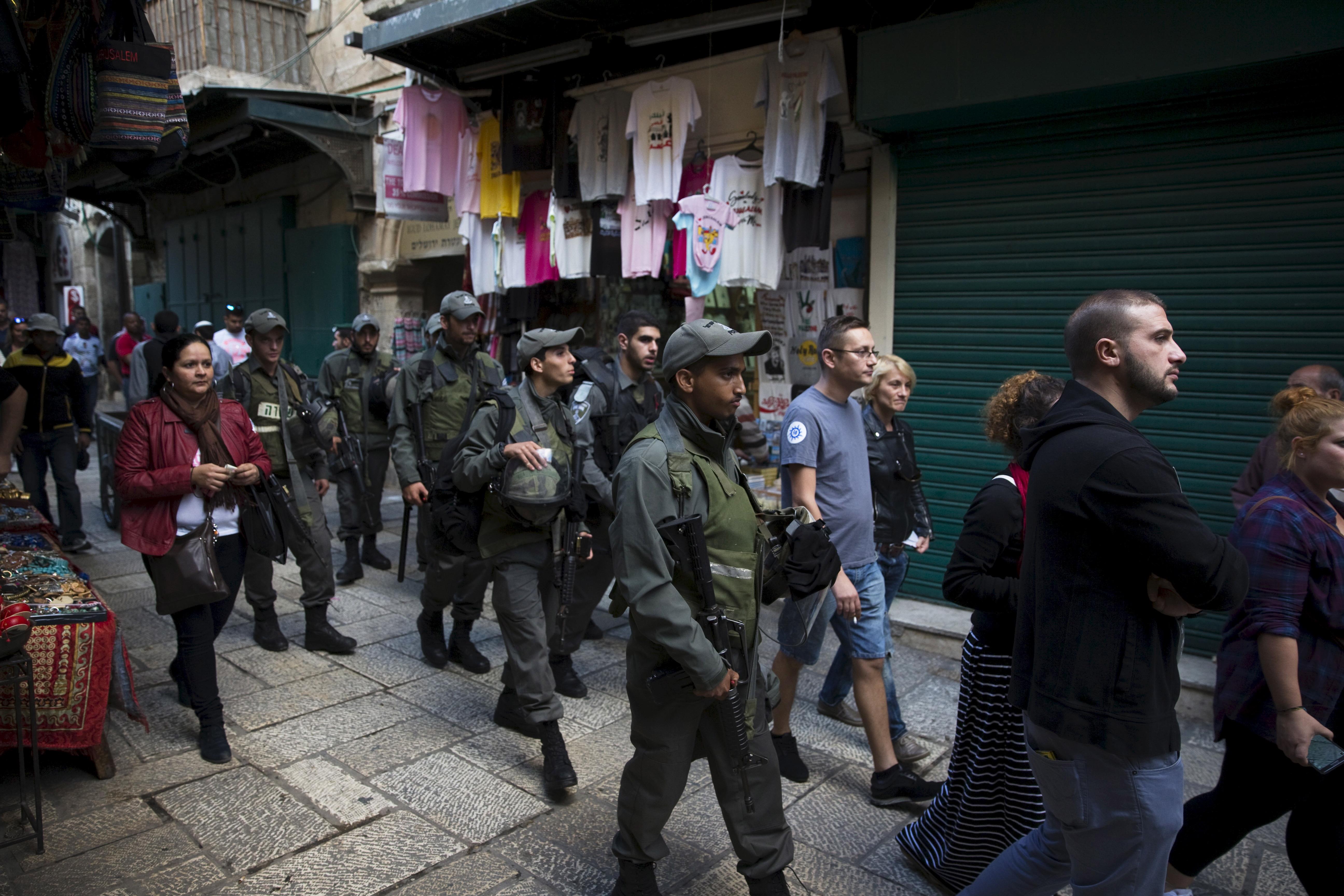 Israeli border policemen patrol the Via Dolorosa street in Jerusalem's Old City 