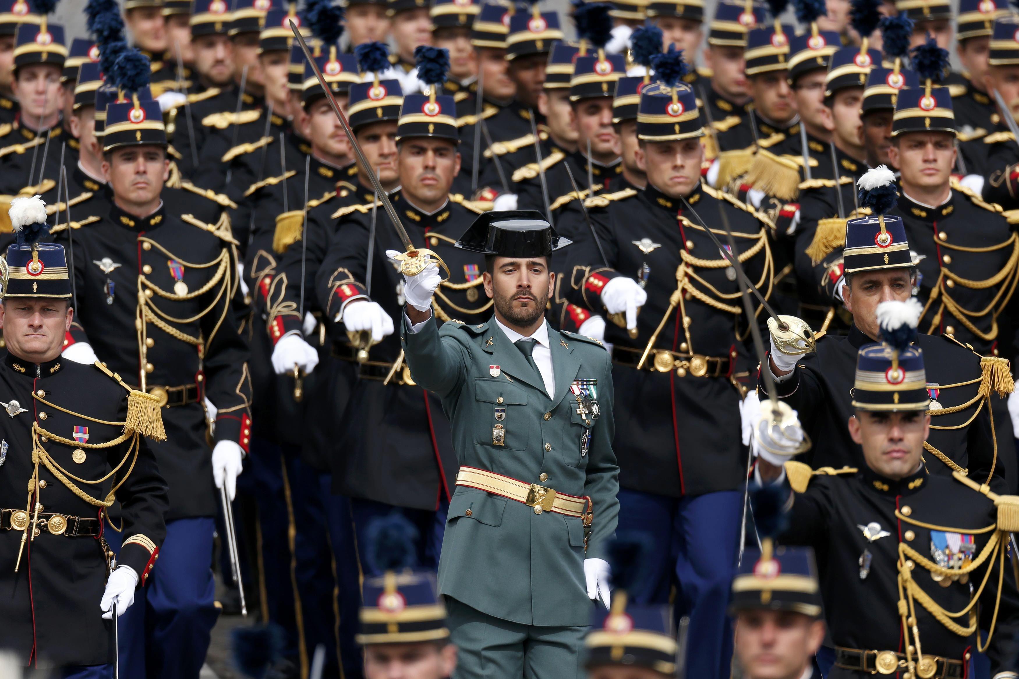 A member of the Spanish Guardia Civil attends the Bastille Day military parade on the Champs-Elysees