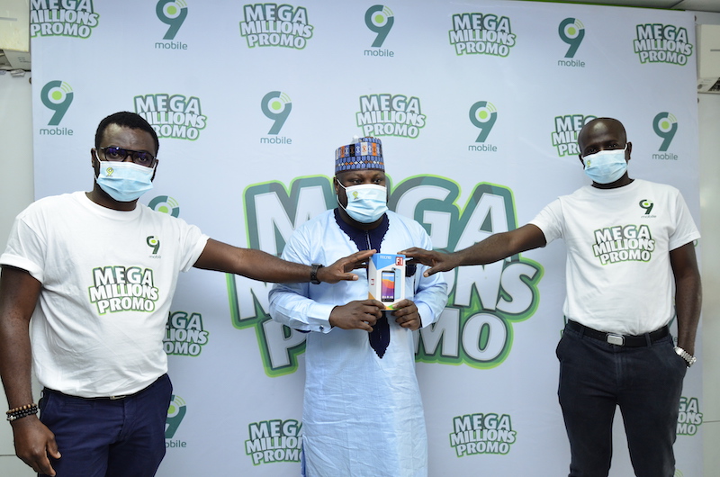 Seni Ogunkola, 9mobile Head of Marketing Communications; Alhaji Bala Sani, Smartphone winner and Oladimeji Opeseyitan, 9mobile Customer Experience Management at the ongoing 9mobile Mega Millions Promo prize presentation held in Lagos recently