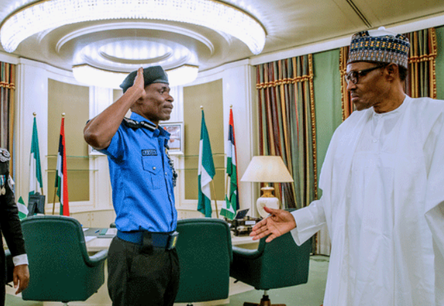 The Inspector-General of Police (IGP), Mohammad Adamu salutes President Muhammadu Buhari. (Channels TV)