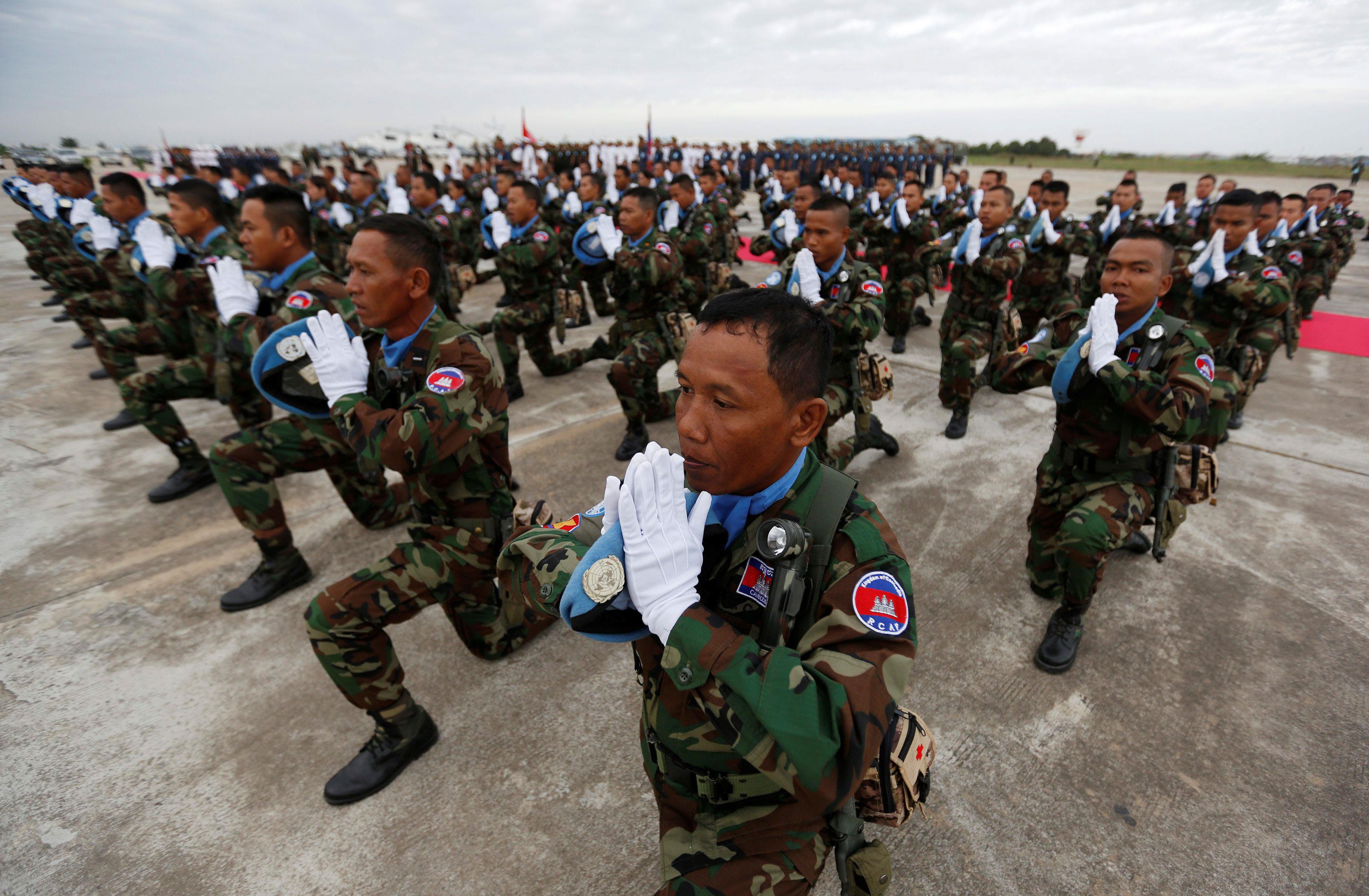 Cambodian soldiers serving with the United Nations Interim Force in Lebanon (UNIFIL), pray during a 