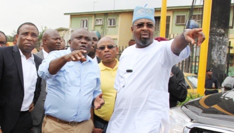 Gov. Akinwunmi Ambode inspecting some projects alongside Folarin Folorunsho Coker (Punch)