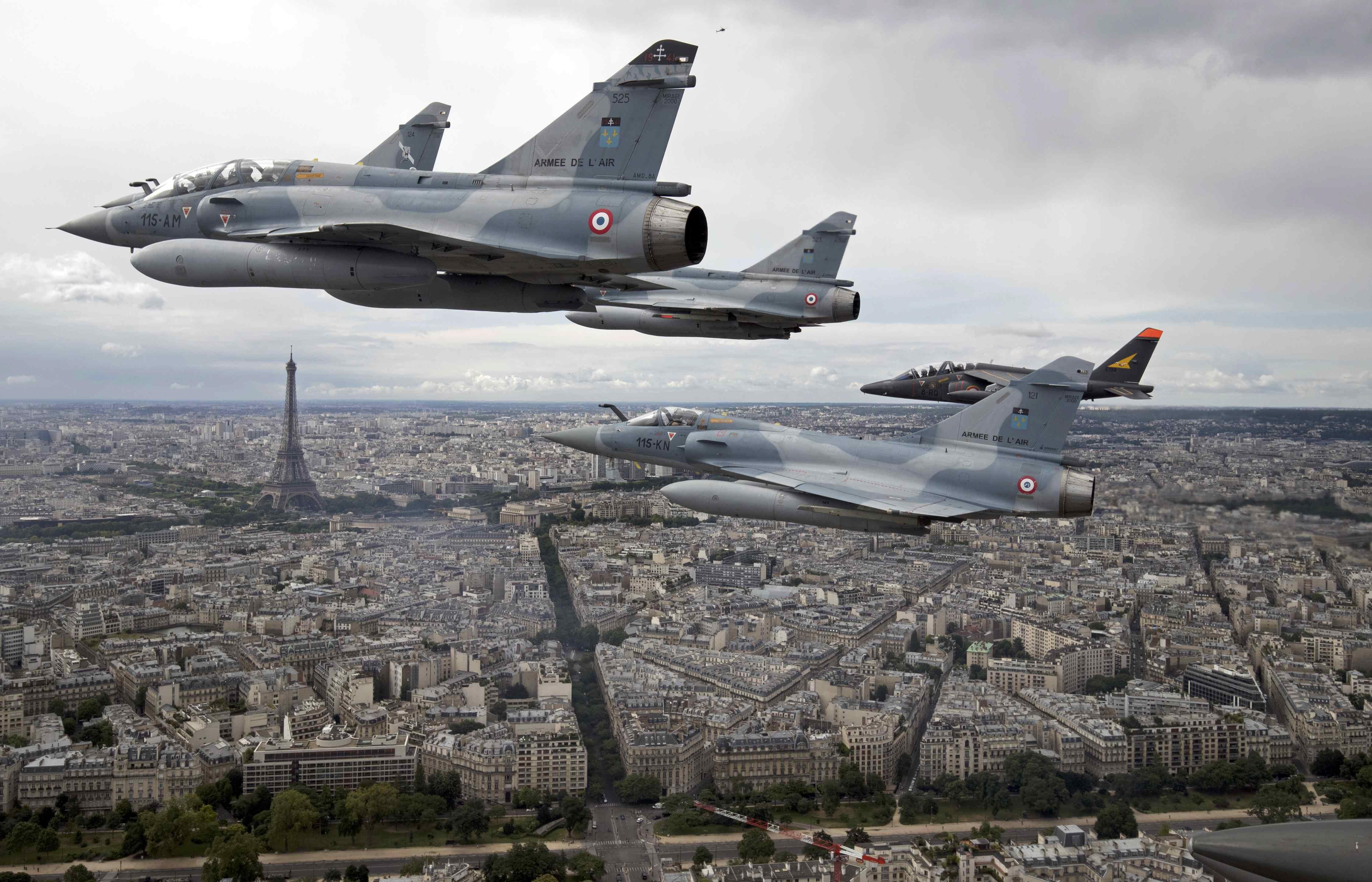 Four Mirage 2000C and one Alpha jet flight over Paris on their way to participate in the Bastille Da