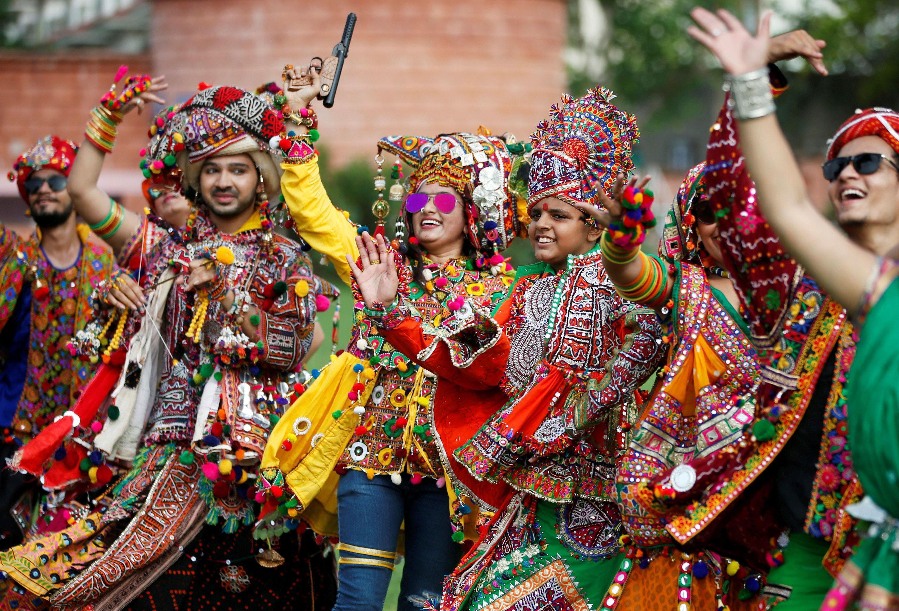 Performers dressed in traditional attire rehearse for Garba, a folk dance, ahead of Navratri, a fest