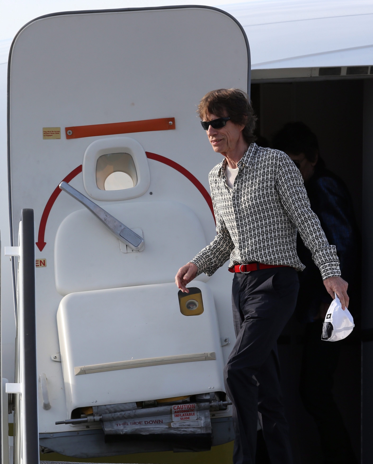 Mick Jagger na lotnisku w Hawanie