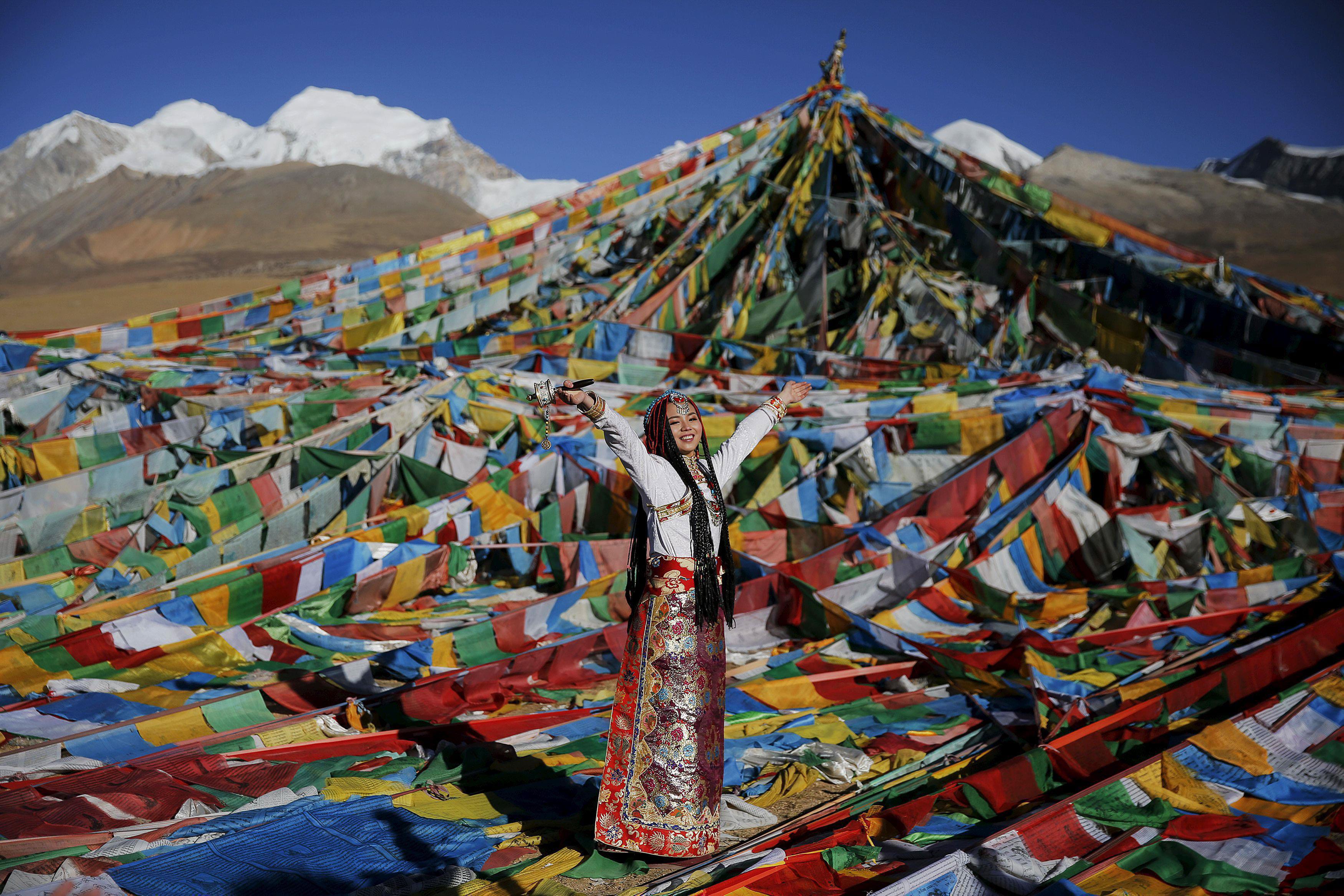 Jing Li wears Tibetan traditional costume as she gets ready for her wedding photo to be taken at the