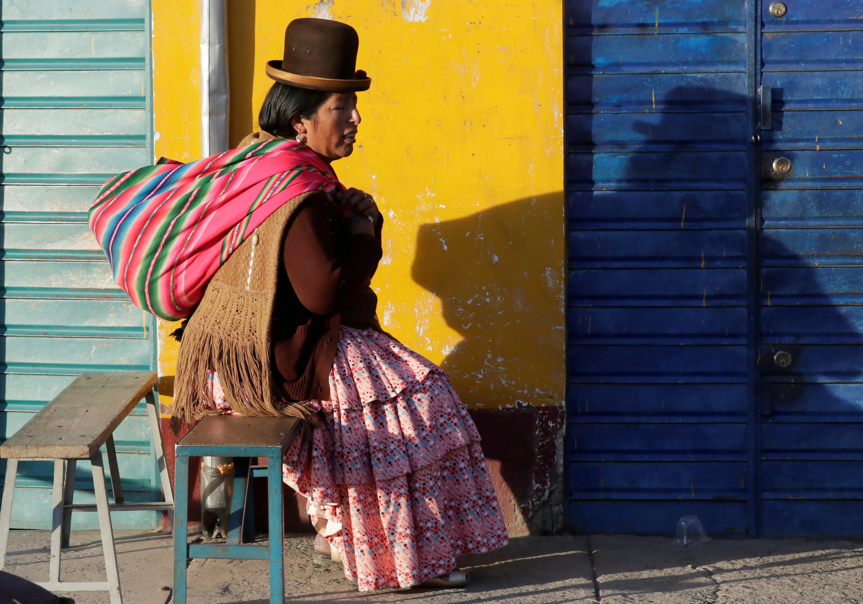 An Aymara women rests in El Alto