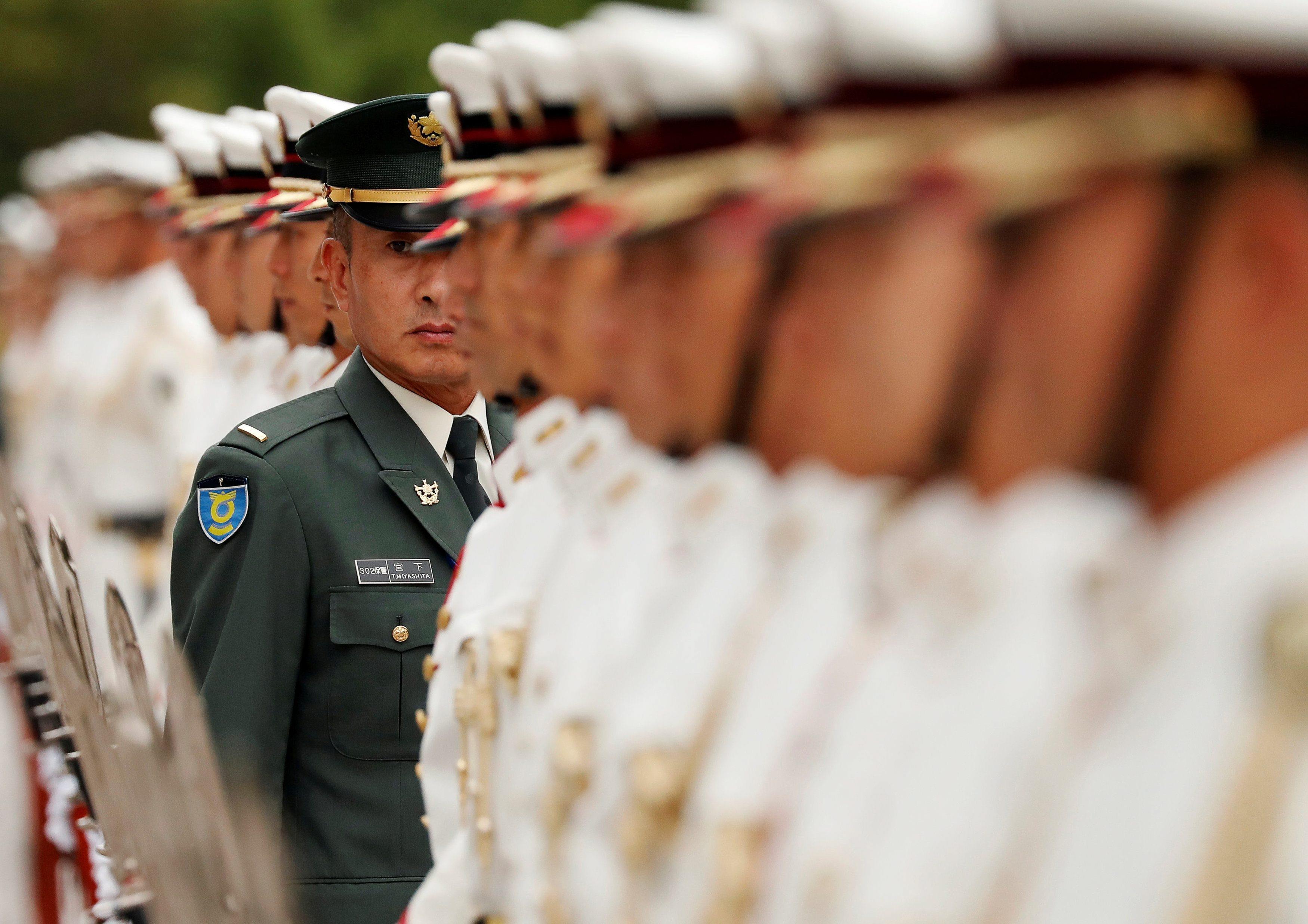 Members of Japan's Self-Defence Forces' honour guard prepare for a ceremony for new U.S. Indo-Pacifi
