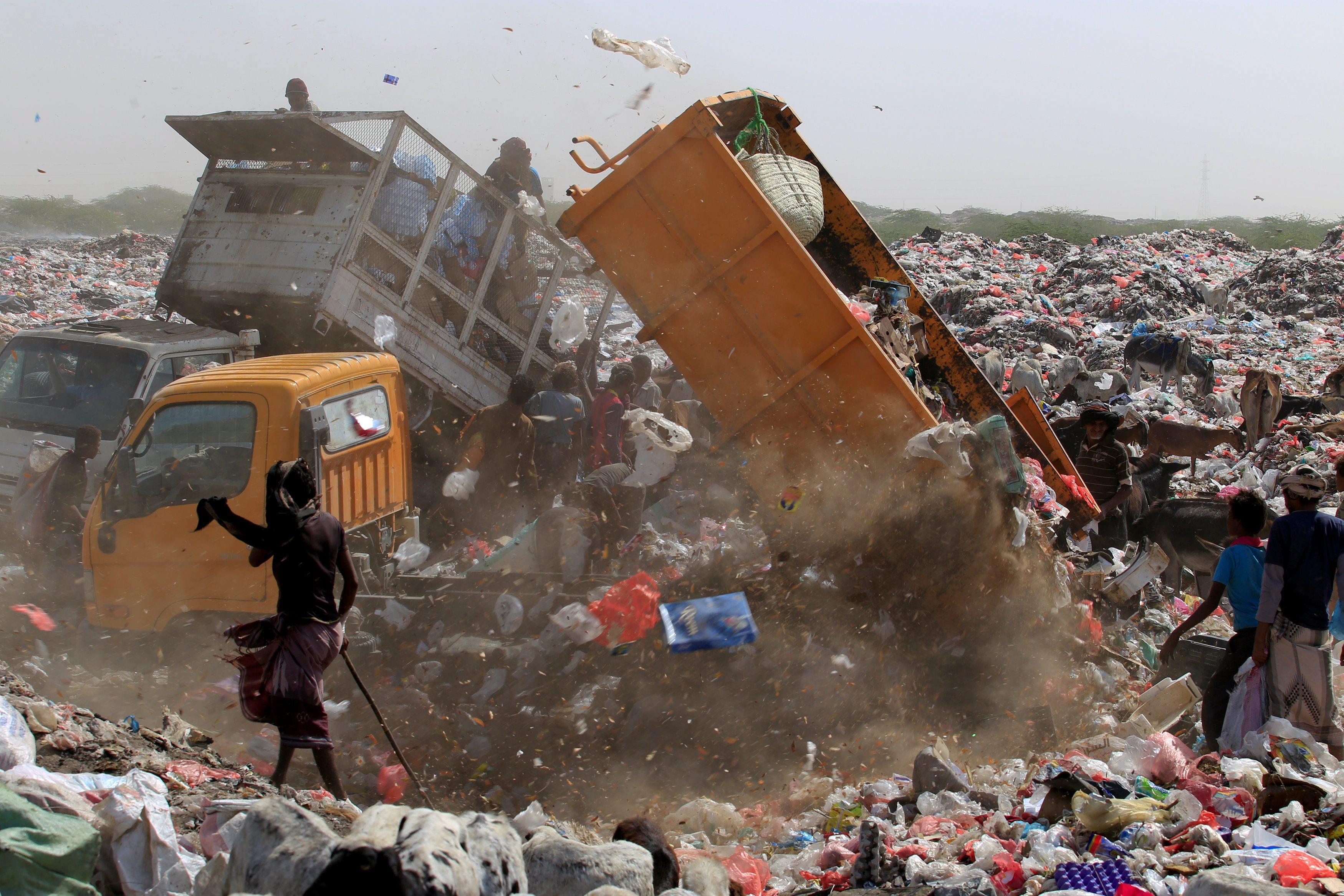 The Wider Image: Displaced Yemeni family sift through garbage for food