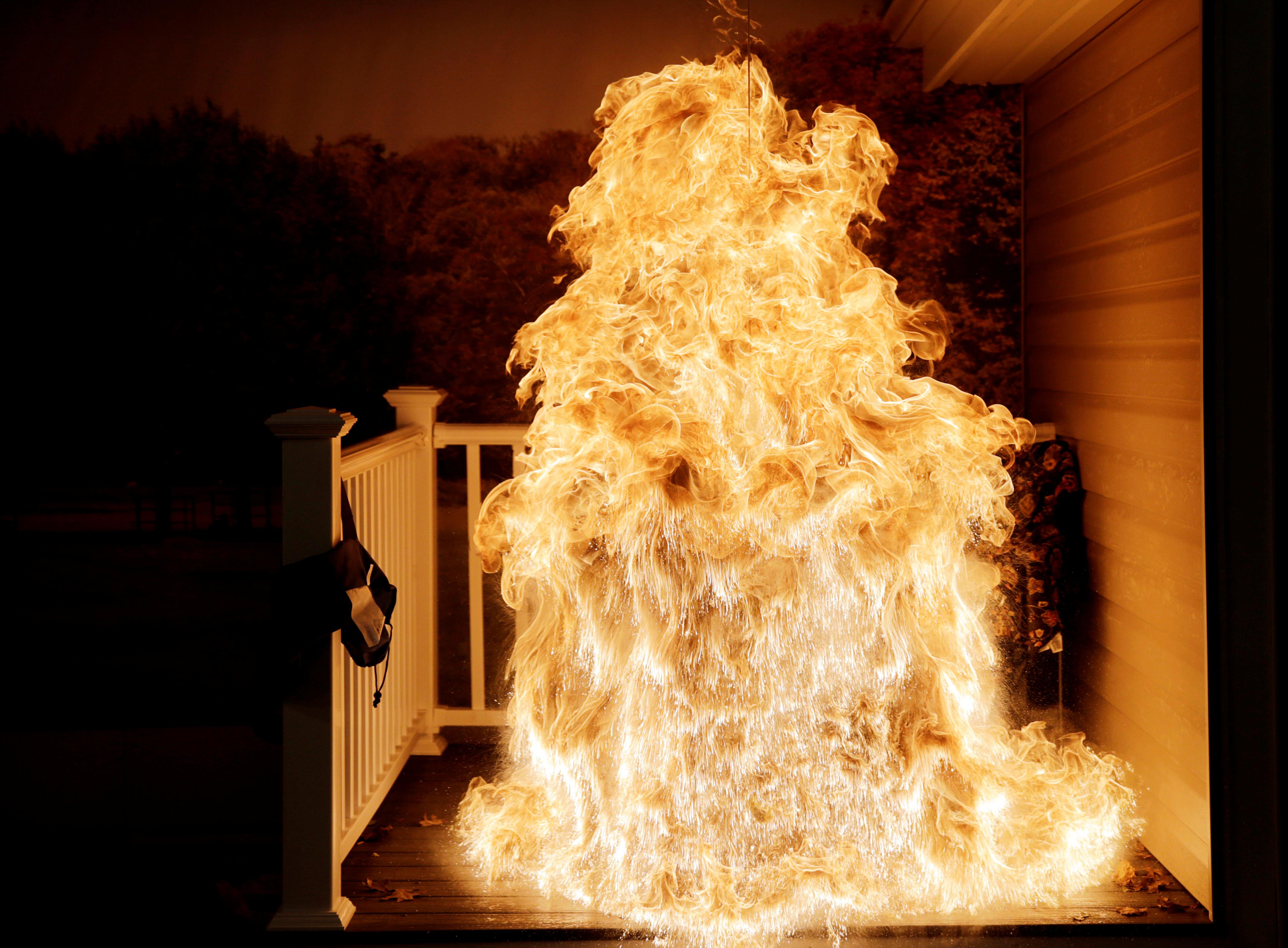 Frozen turkey is dropped into deep fryer and creates a large fireball at a food safety demonstration