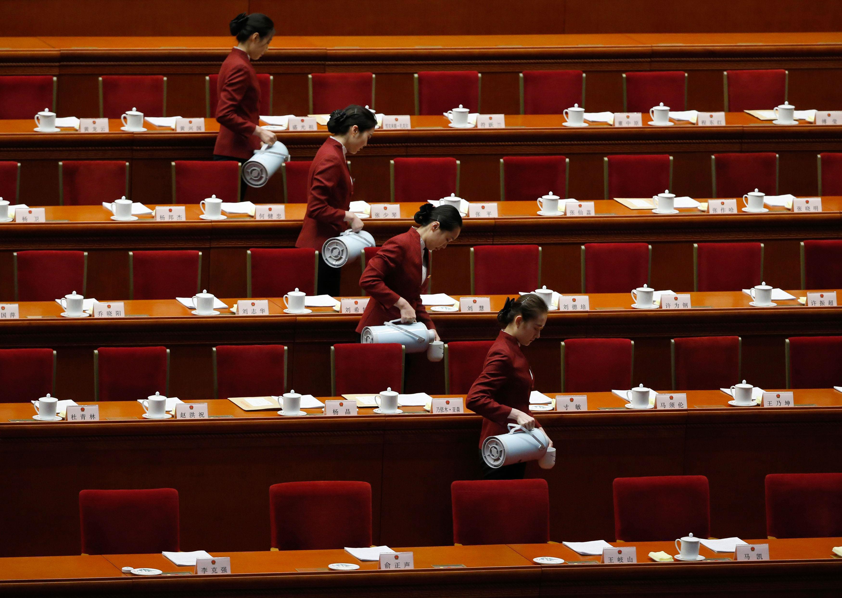 Attendants prepare tea inside the Great Hall of the People ahead of the second plenary session of th
