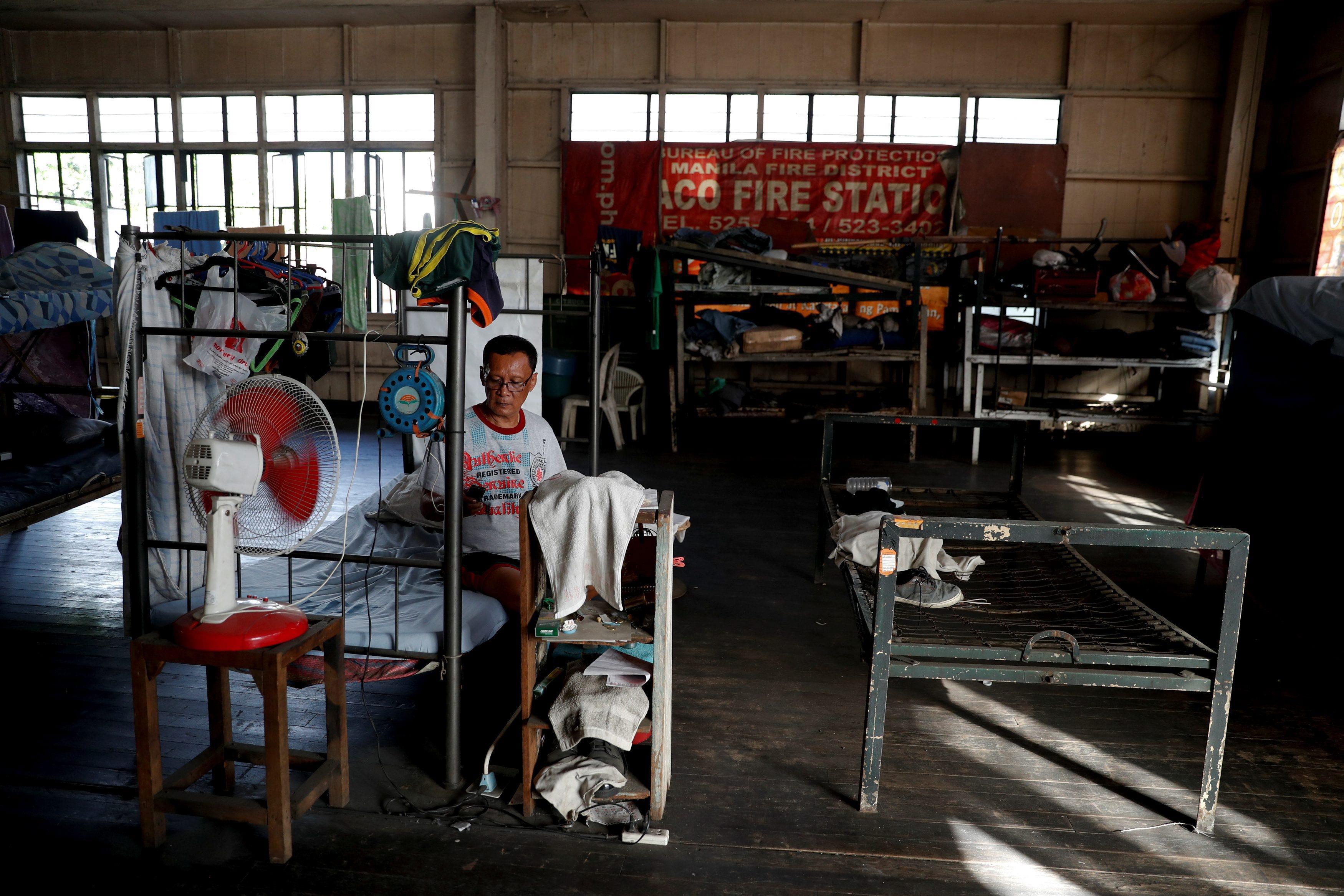 The Wider Image: Manila's slums an endless battle for firefighters