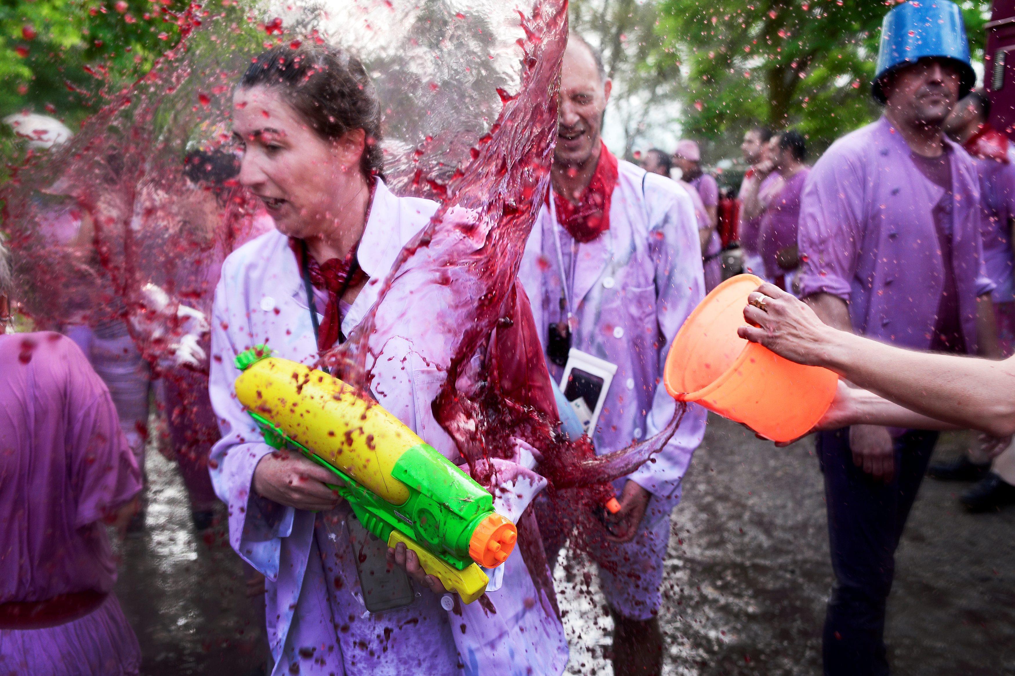 A reveller has wine thrown at her during the Batalla de Vino (Wine Battle) in Haro
