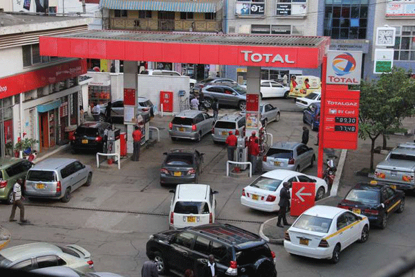 A busy petrol station in a past photo. [Source/ Courtesy]