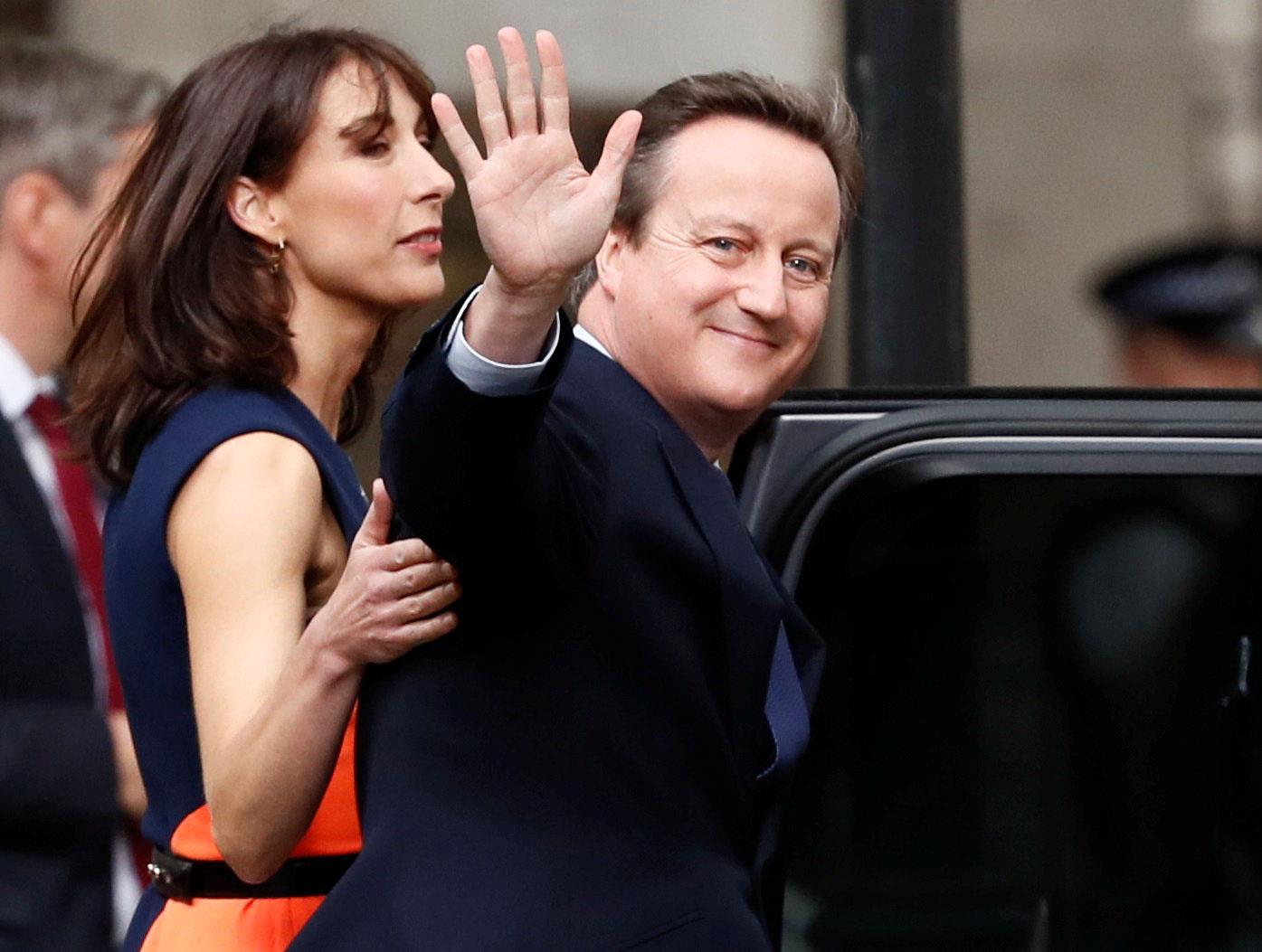 Britain's outgoing Prime Minister, David Cameron,waves in front of number 10 Downing Street, in cent