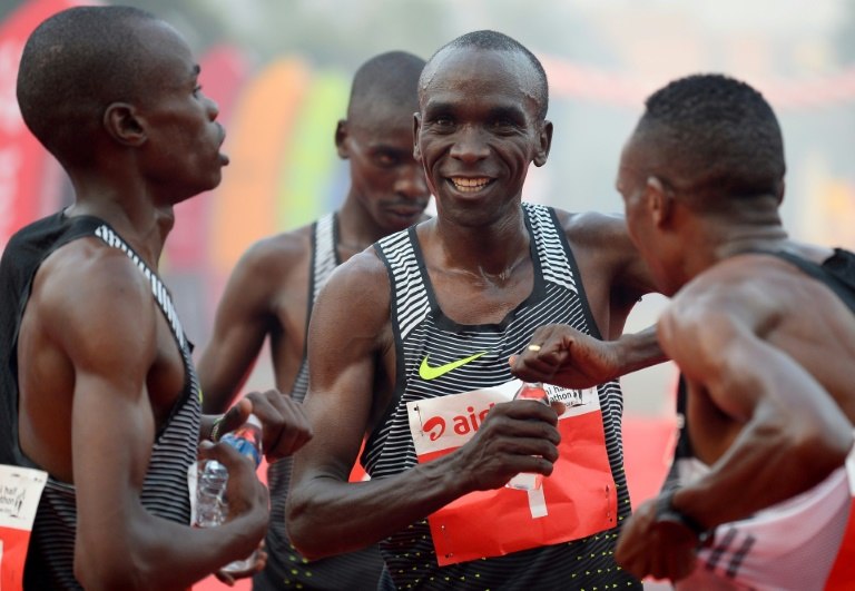 Kenyan Olympic gold medallist marathon runner Eliud Kipchoge (C) is one of three top runners selected by Nike to make the marathon record attempt later this year
