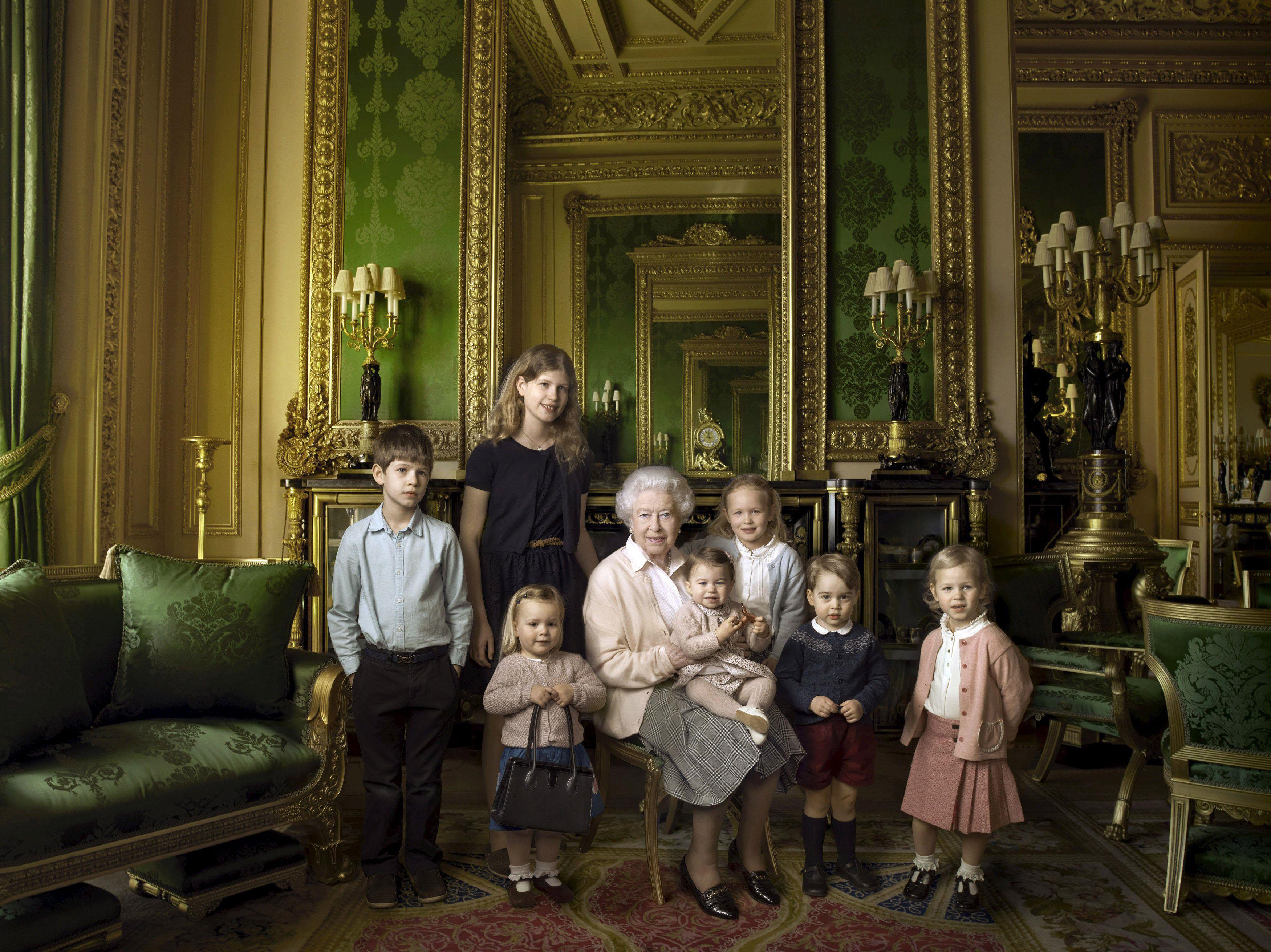 Britain's Queen Elizabeth II poses with her five great-grandchildren and her two youngest grandchild
