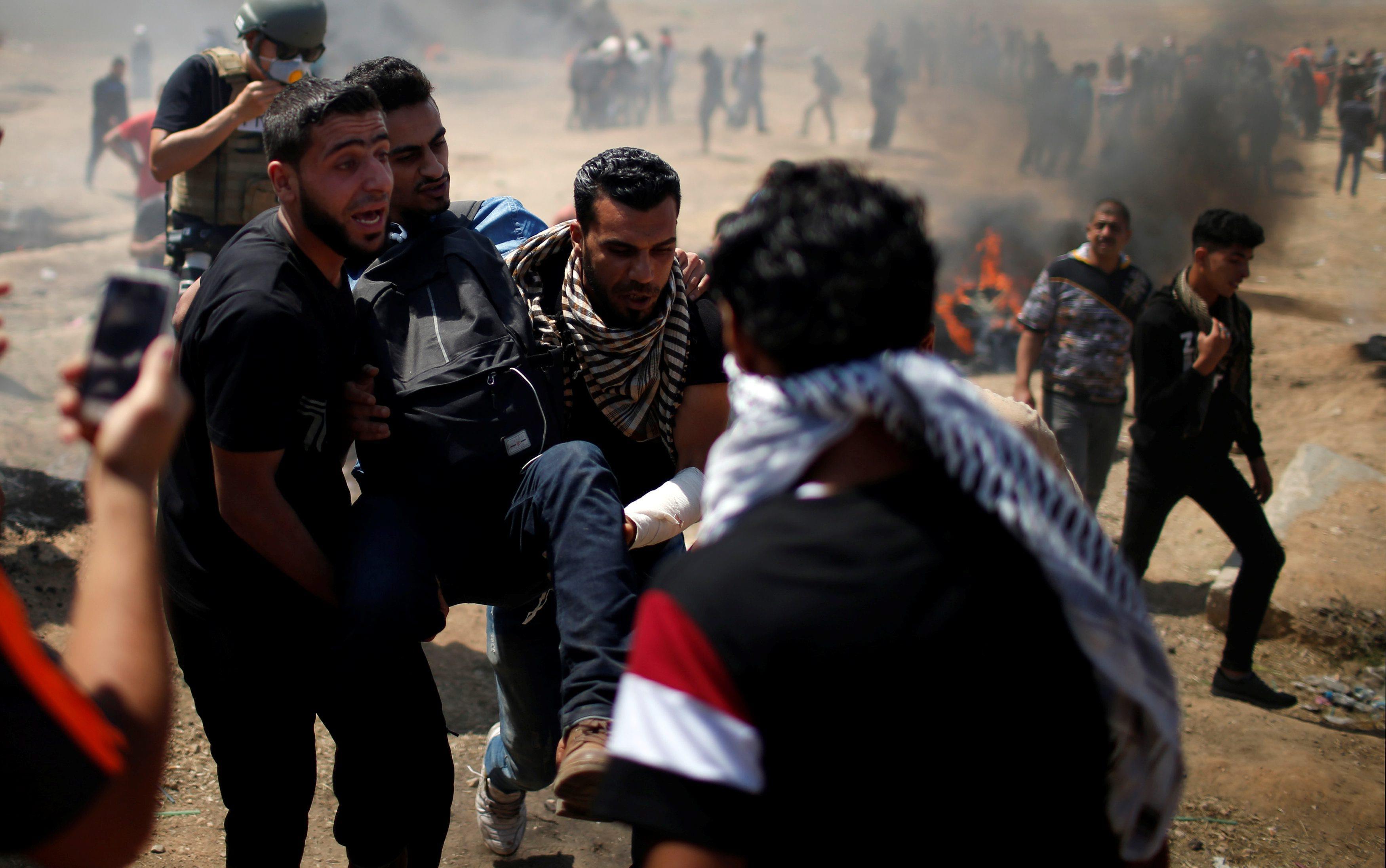 Wounded Palestinian is evacuated during a protest against U.S. embassy move to Jerusalem and ahead o