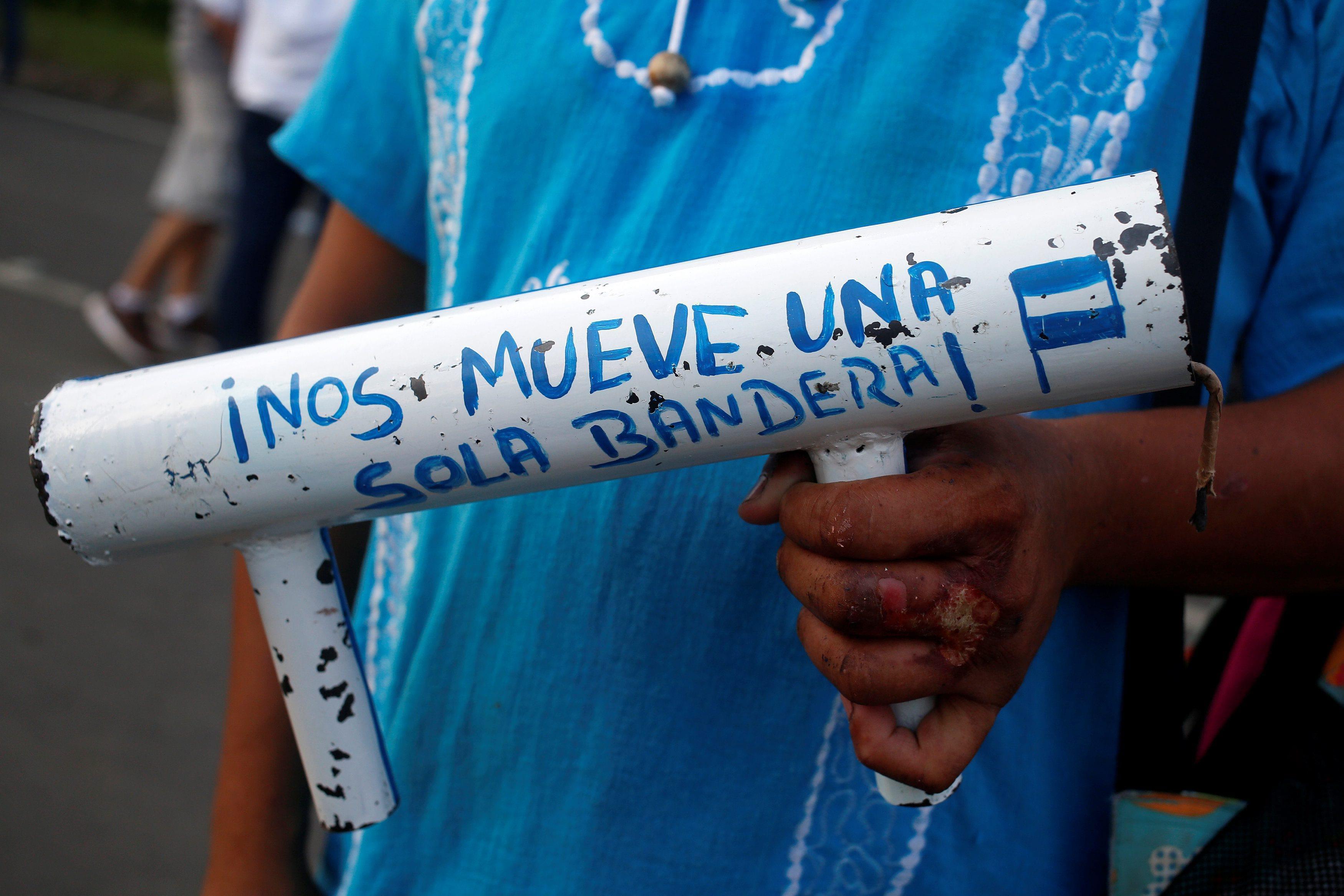 A protester holds a homemade mortar during a protest against President Daniel Ortega's government in