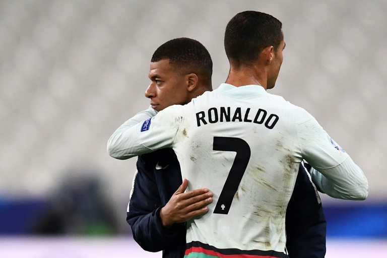 Kylian Mbappe looks up to Cristiano Ronaldo