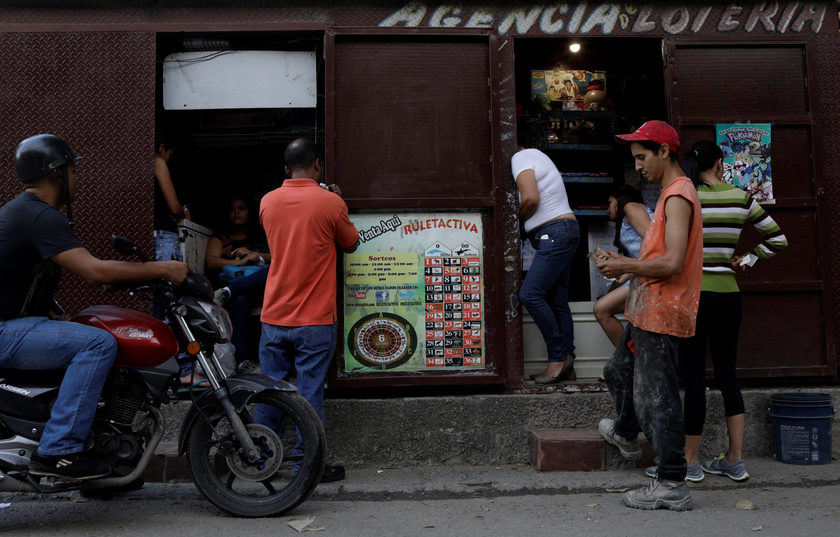 The Wider Image: Venezuelan crisis spawns boom in gambling