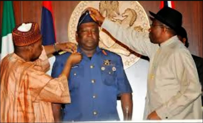 Goodluck Jonathan decorates Air Marshal Alex Sabundu Badeh as Chief of Defence Officer in 2014