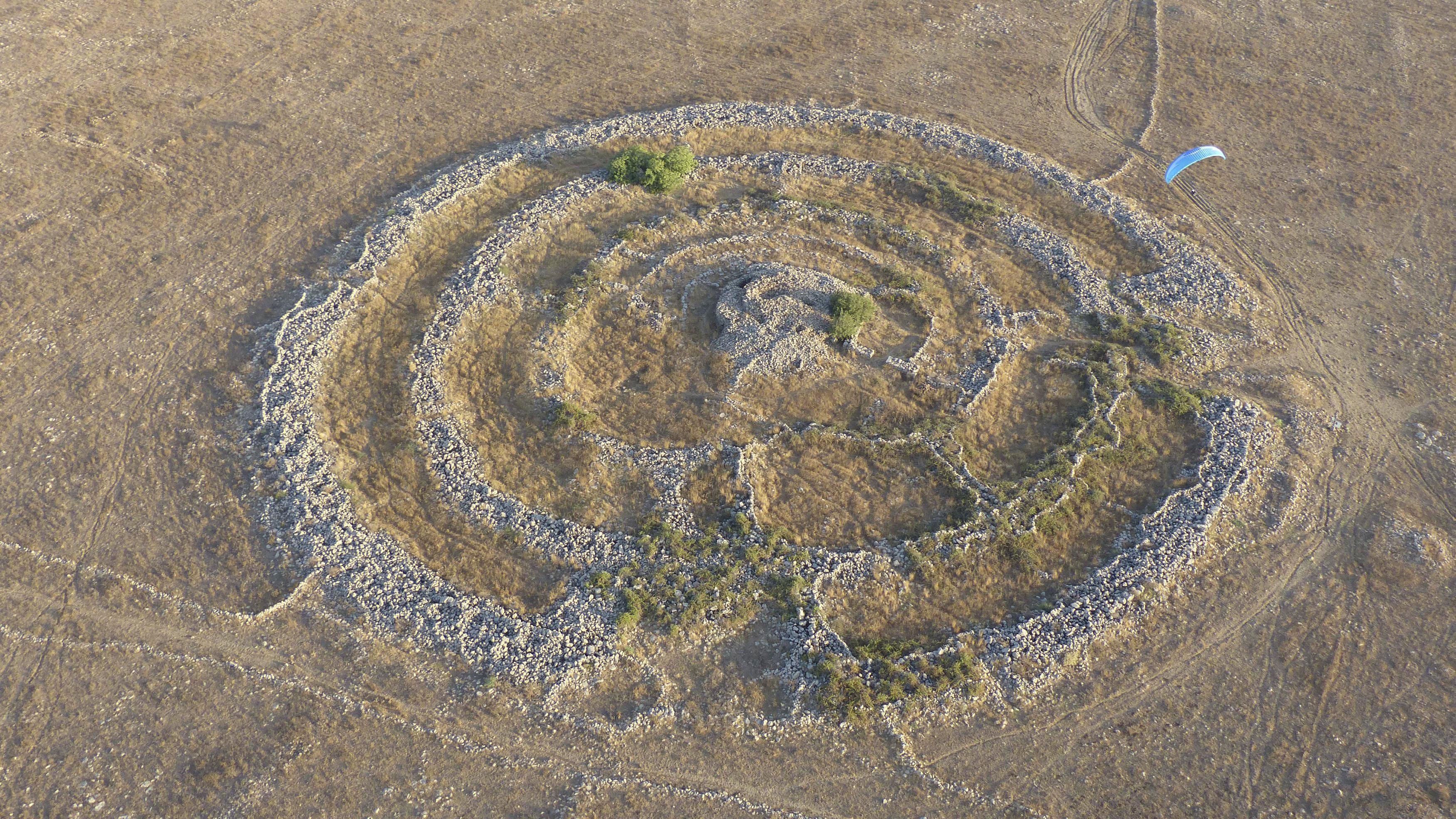 A general aerial view shows a prehistoric stone monument, known as Rujm el-Hiri in Arabic, as a para