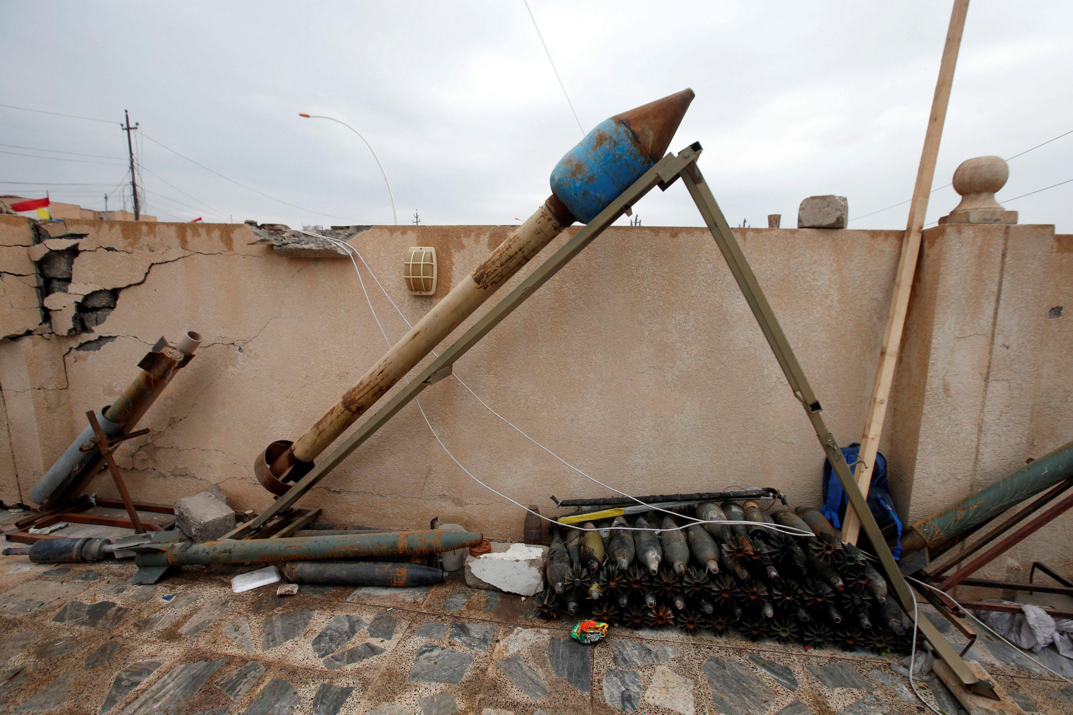 Weapons and ammunition belonging to Islamic State militants are seen in the town of Bashiqa, east of