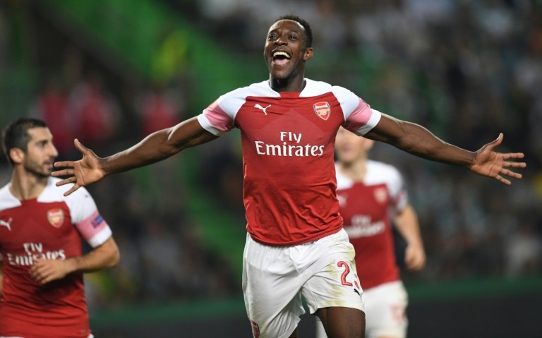 Danny Welbeck celebrates netting the winner for Arsenal in Lisbon