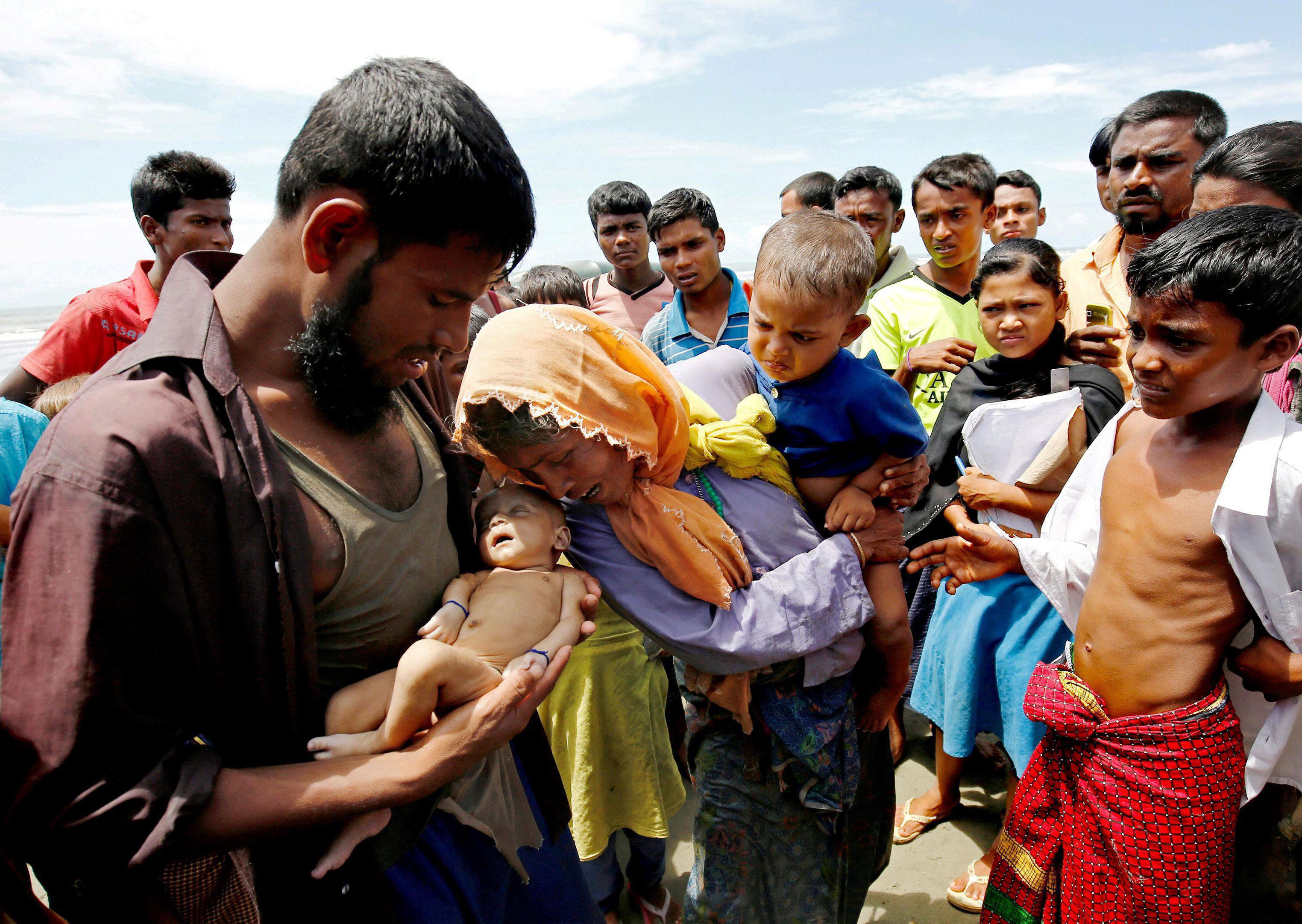 A Picture and its Story: Rohingya grieve after baby dies in border crossing