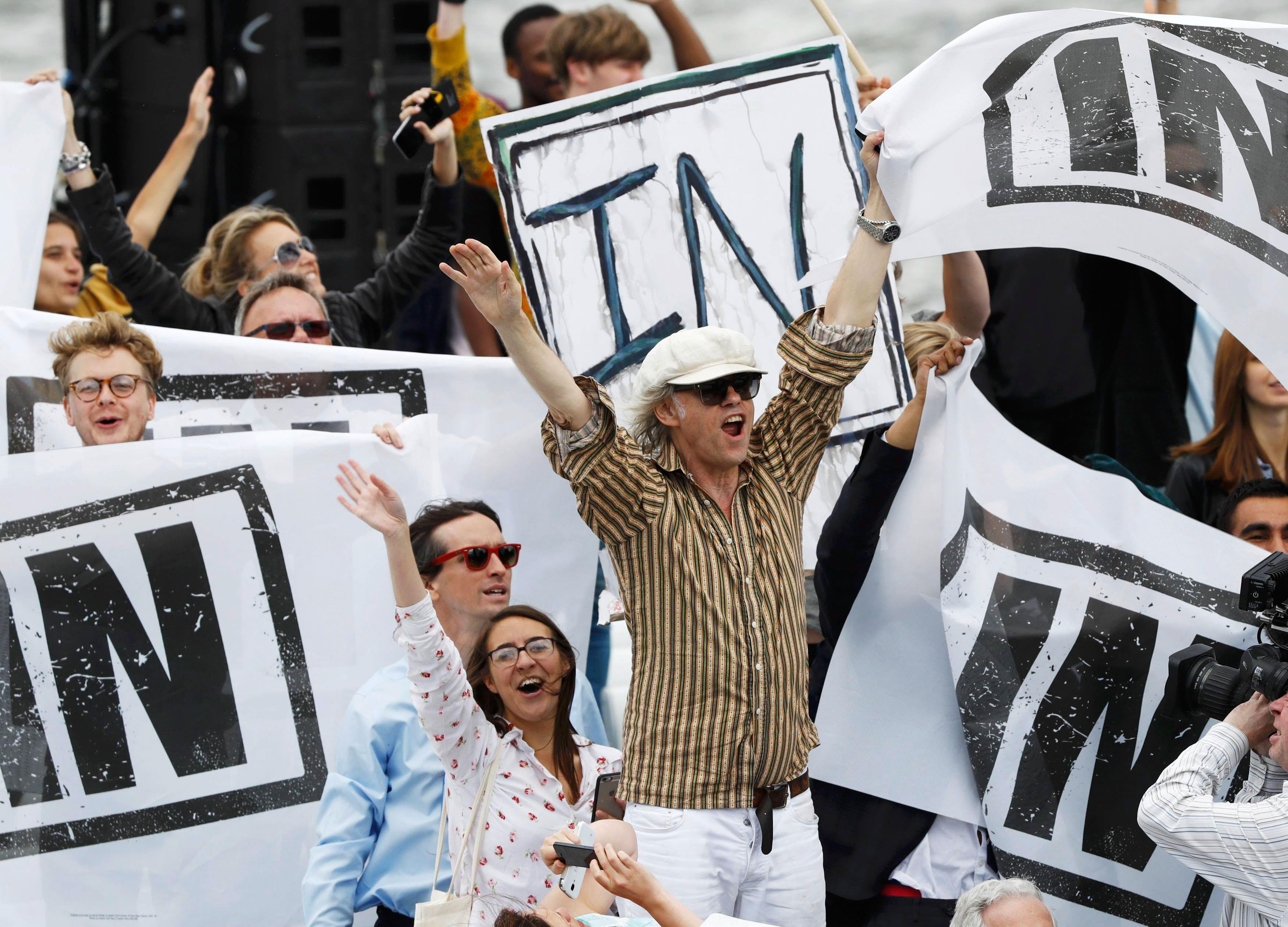 Musician and campaigner Bob Geldof (C) joins a counter demonstration as a flotilla of fishing vessel