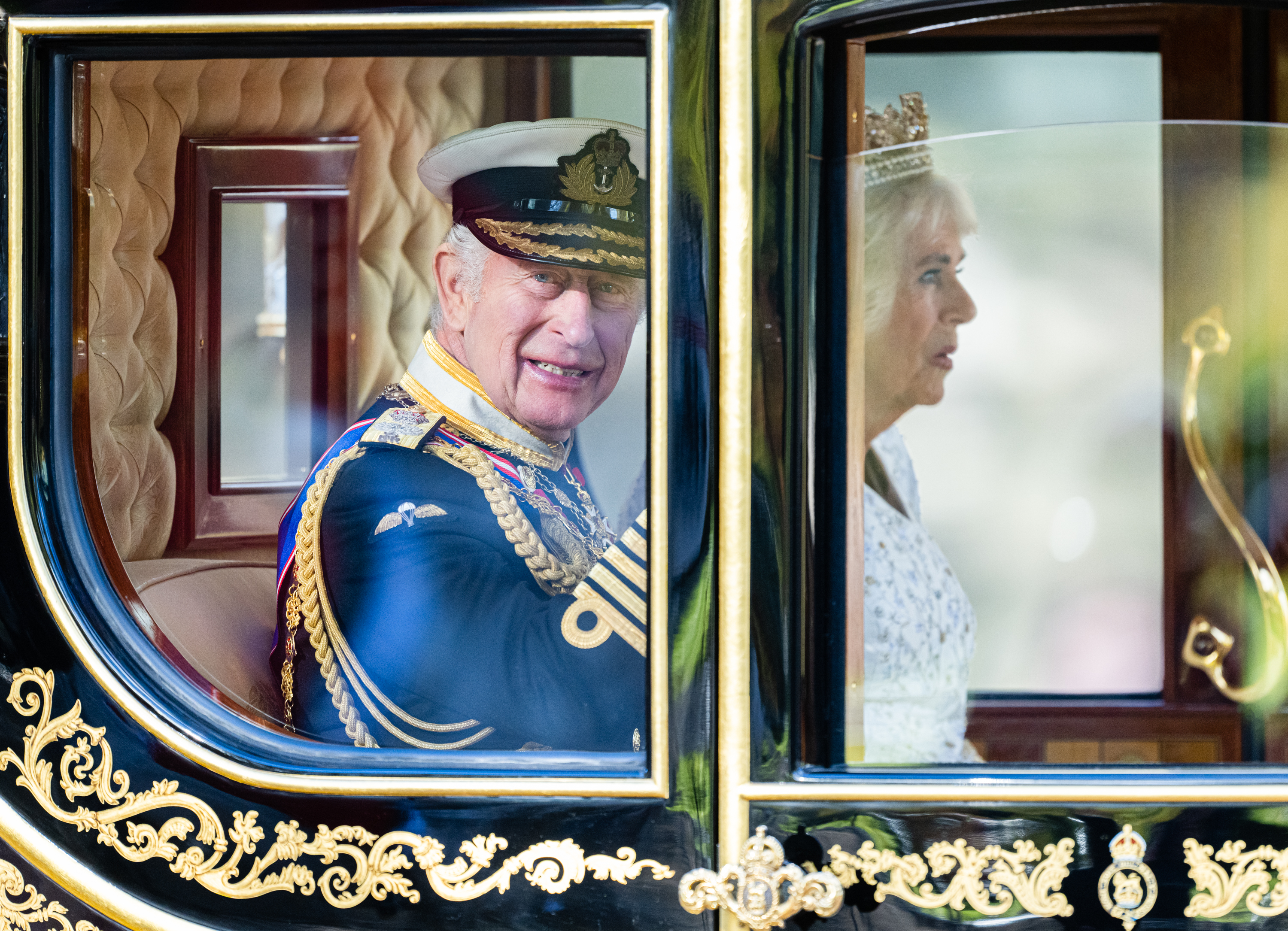 King Charles III and Queen Camilla travel down the Mall by carriage on their way to the Houses of Parliament for The State Opening of Parliament on November 07, 2023 in London, England