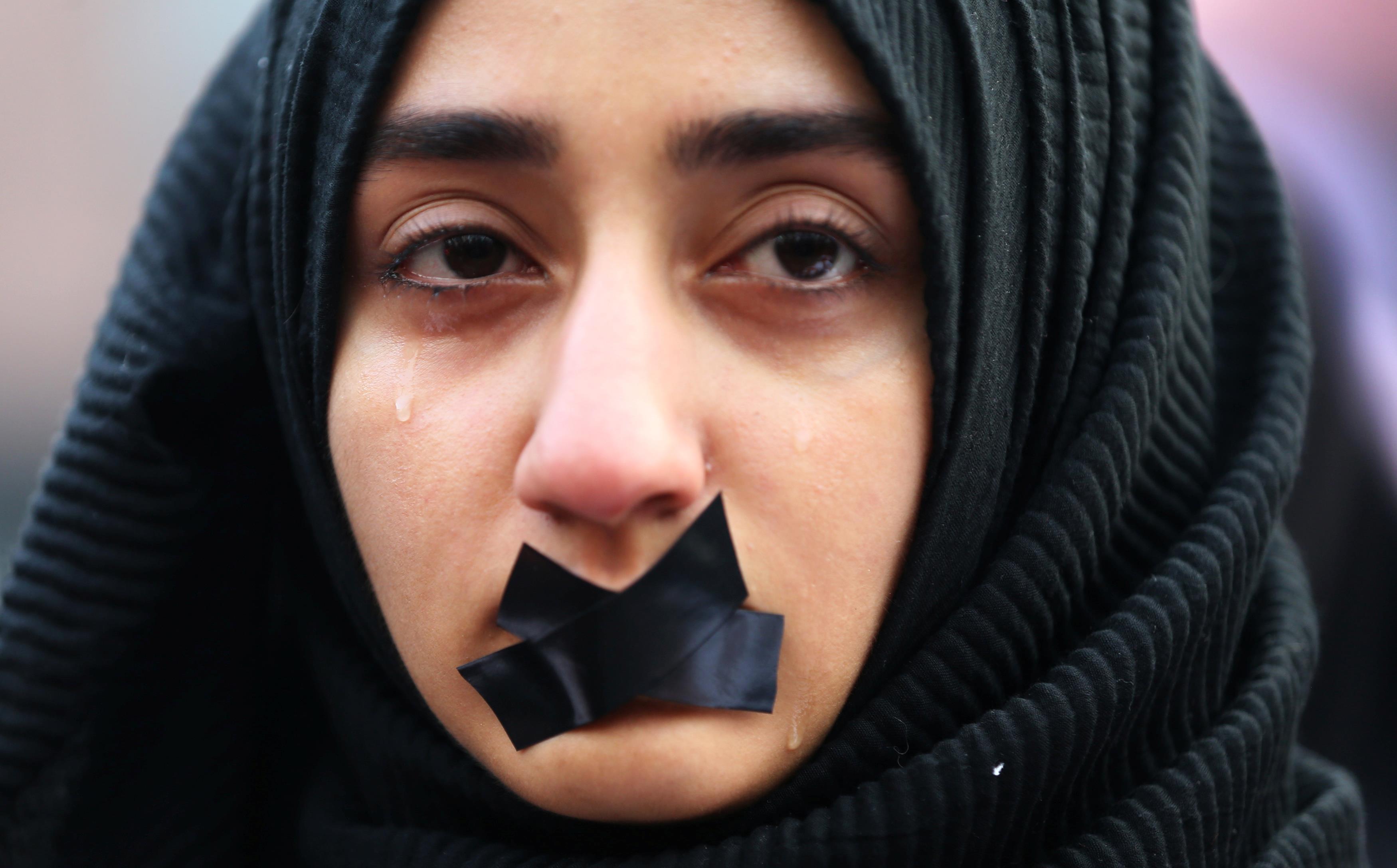 A Turkish student cries during a protest to show solidarity with trapped citizens of Aleppo, Syria, 