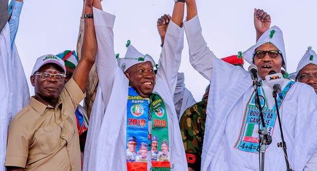 From L-R APC chairman, Adams Oshiomhole, Governor Umar Ganduje and President Buhari at the presidential rally in Kano [Channels Television]