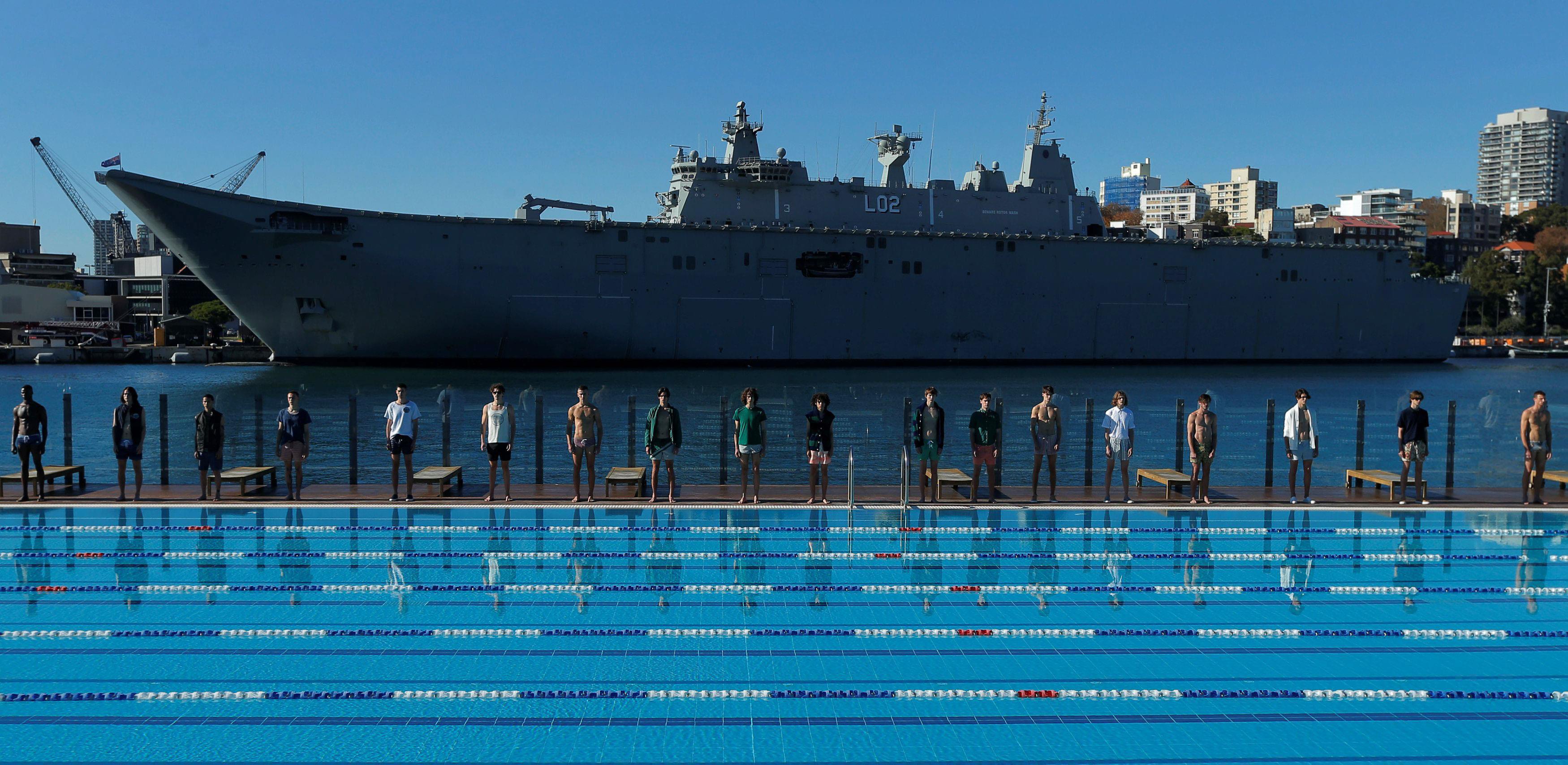 Australia's naval ship HMAS Canberra forms a backdrop as Sydney's Andrew 