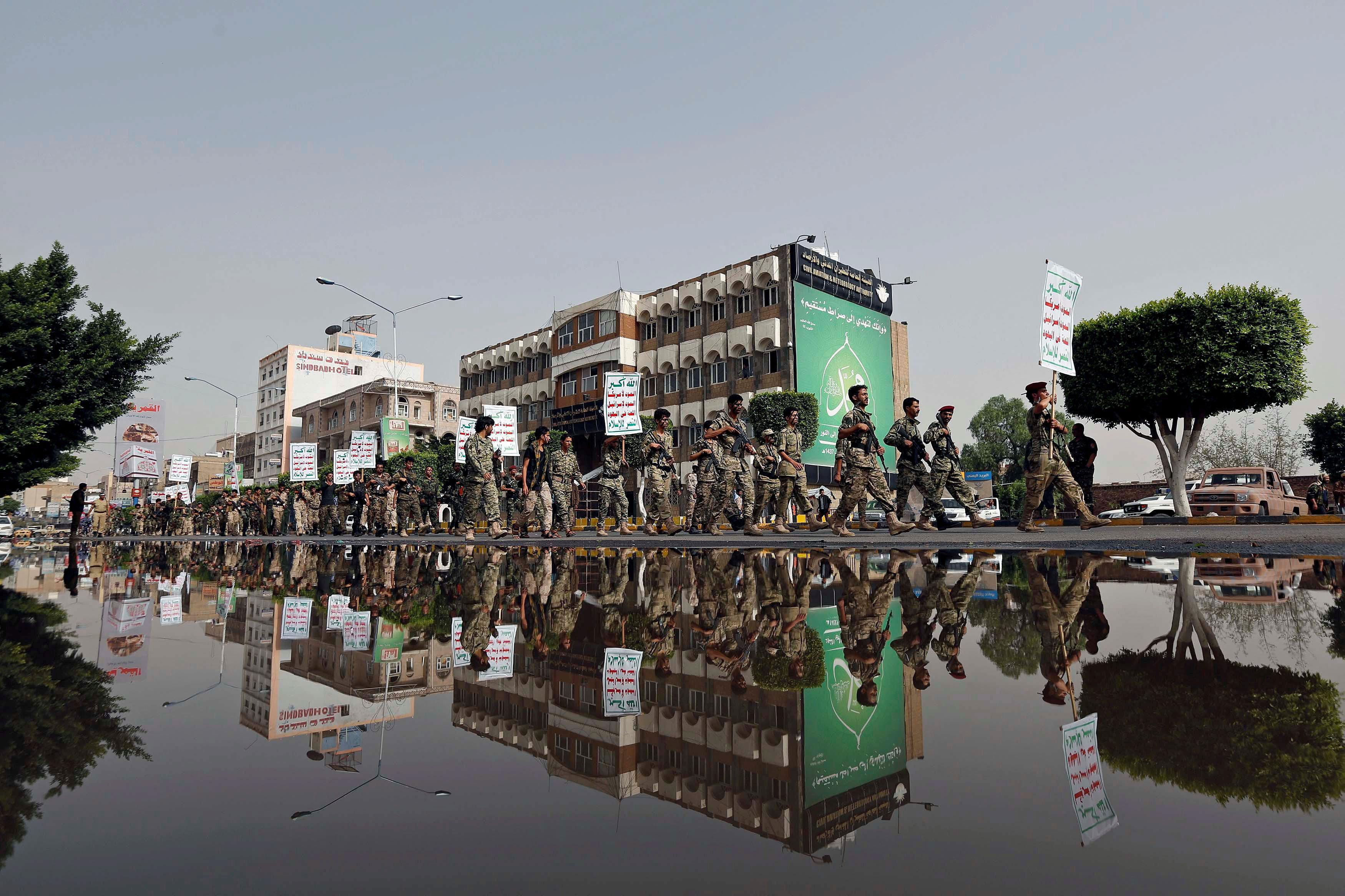 Newly recruited fighters loyal to the Houthi rebels march during a military parade in Sanaa