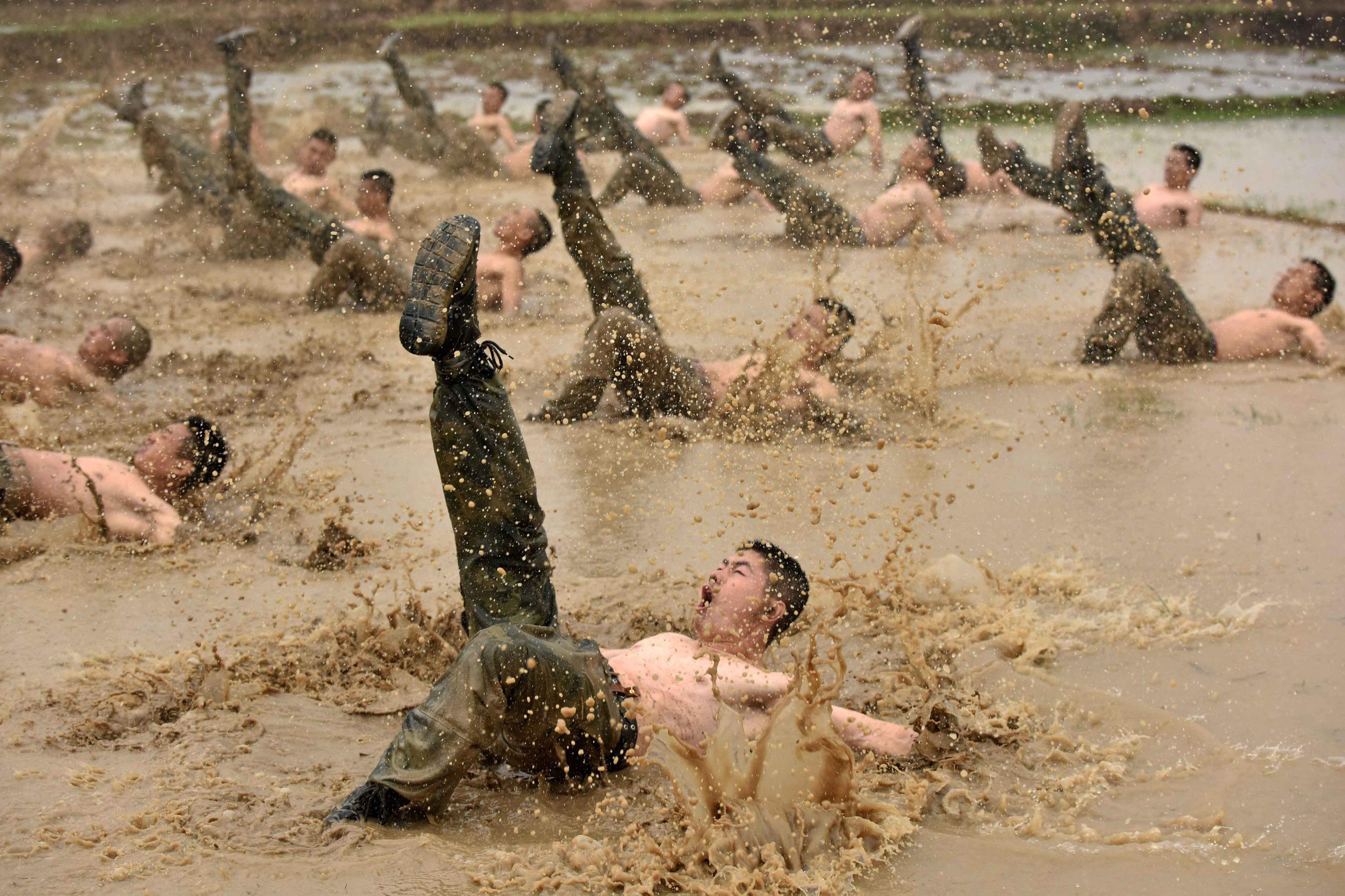 Paramilitary policemen attend a training session in Guigang
